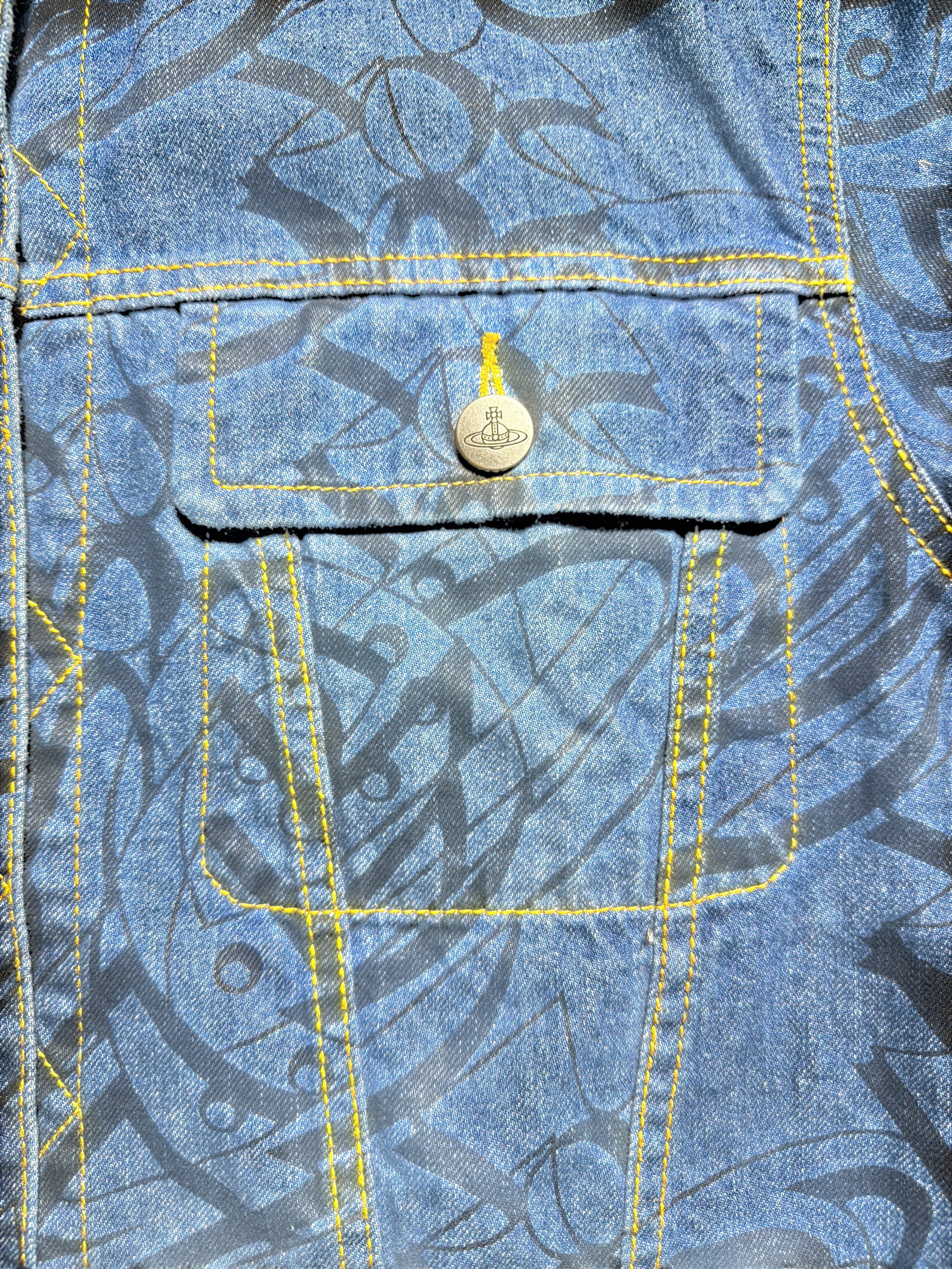 Vivienne Westwood denim jacket featuring a black graphic print and contrast yellow stitching