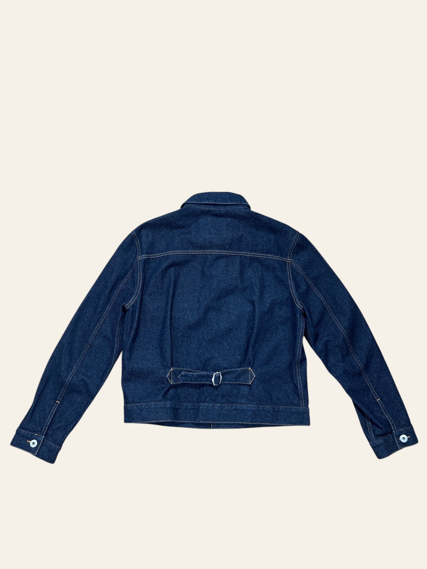 Back view of a Lolly and Lotus VIVIENNE WESTWOOD ANGLOMANIA dark blue denim jacket with a waist cinch buckle.