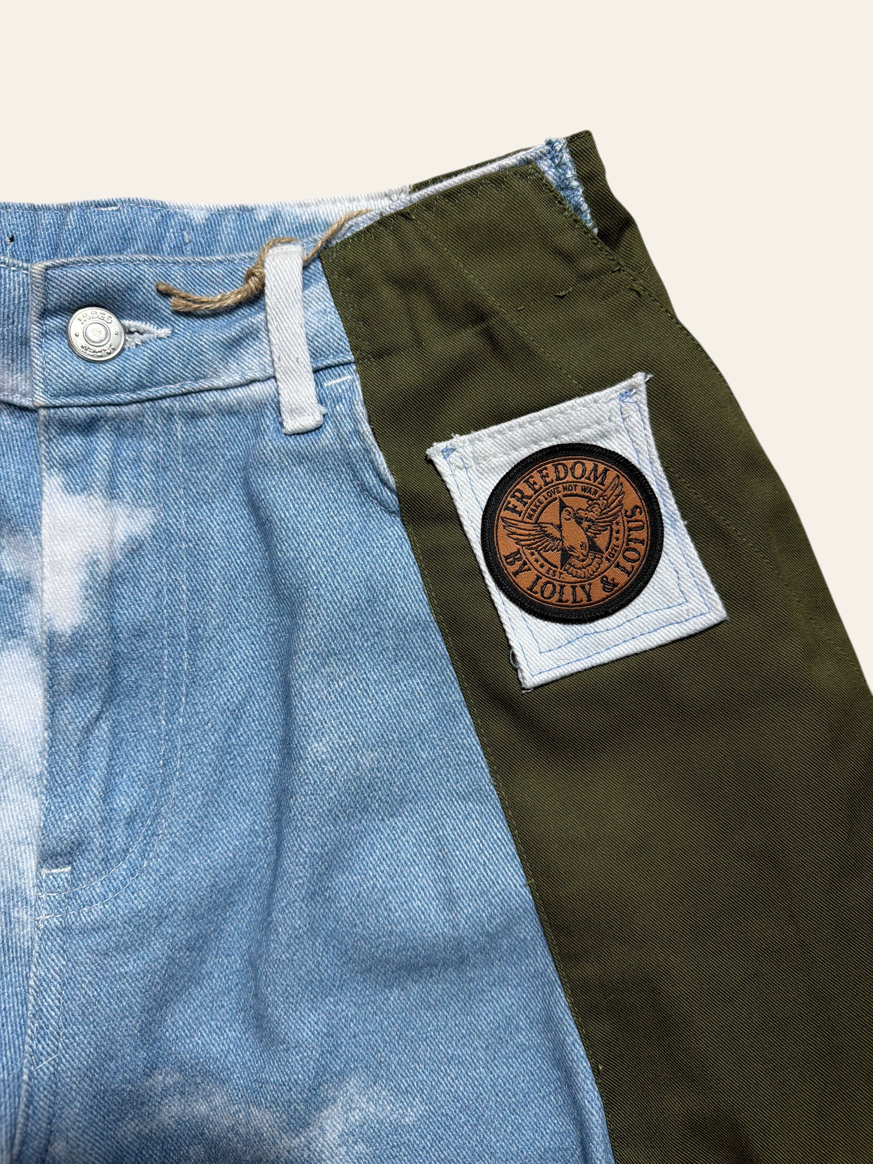 Lolly and Lotus reworked army pants featuring blue acid-wash denim and olive green panels with a circular logo patch.