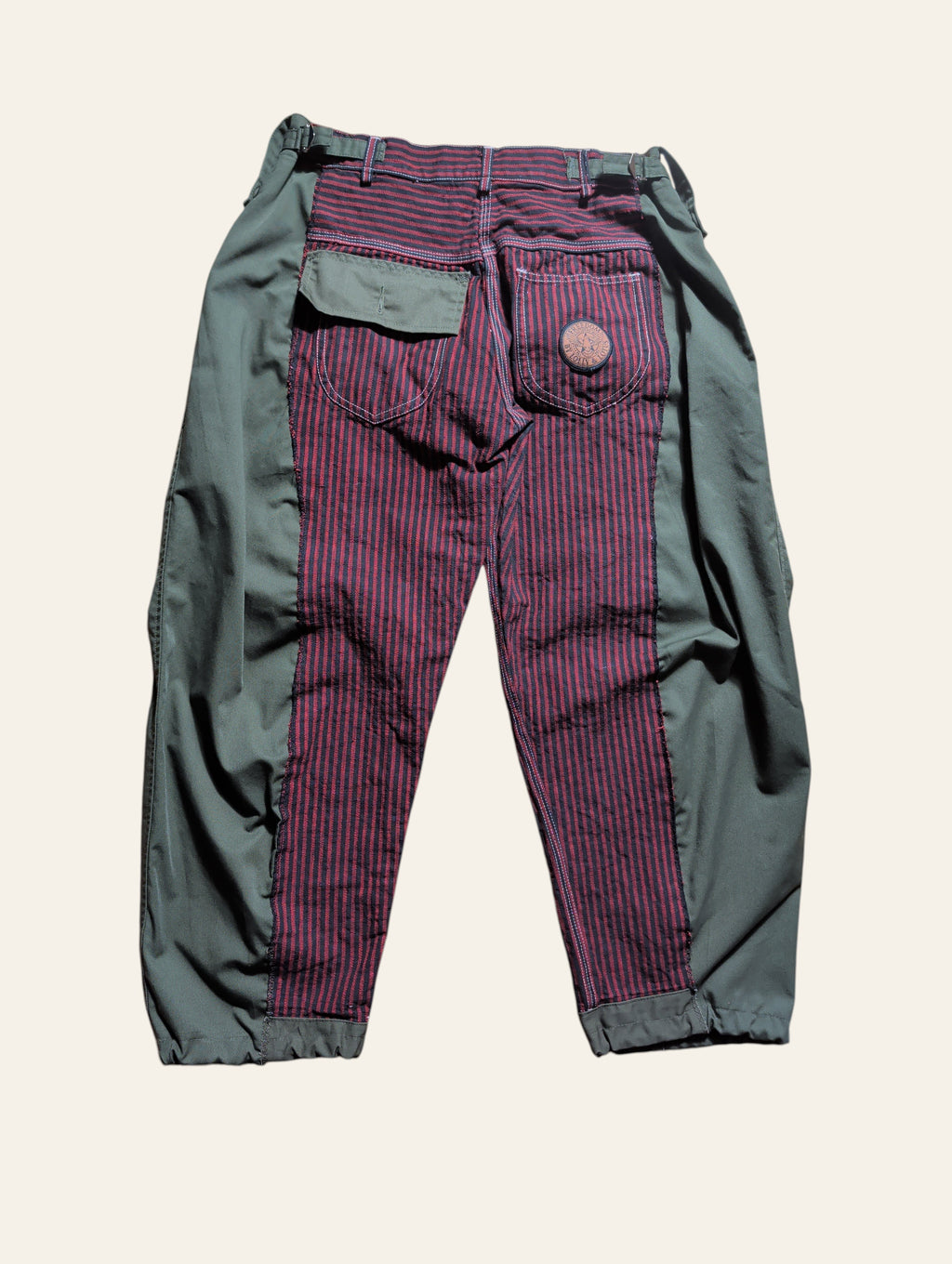 Lolly and Lotus reworked army pants featuring olive green panels and a red and black striped center back design.
