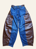 Lolly and Lotus reworked blue denim jeans with brown leather side panels and an integrated waist belt.