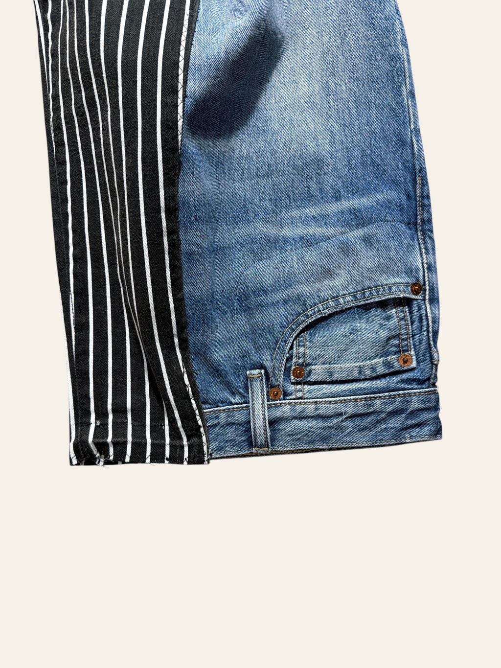 Lolly and Lotus reworked blue denim and black pinstripe jeans with a high-waisted Levi design.