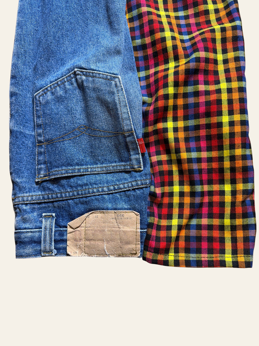 Lolly and Lotus reworked golfing pants featuring blue denim Levi pocket and vibrant multi-colored plaid fabric