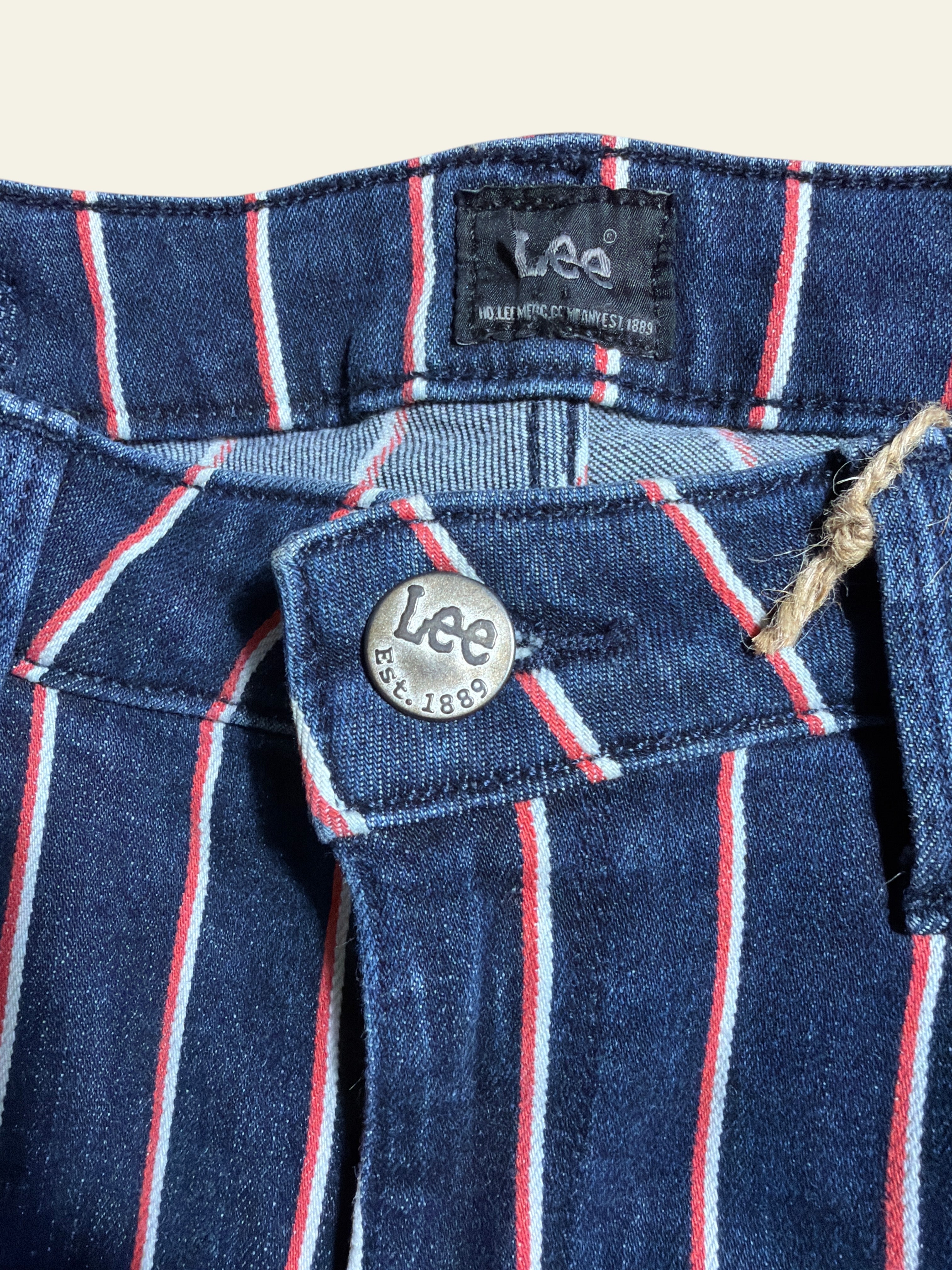 Lolly and Lotus reworked Lee x Army jeans in dark blue denim with vertical red and white pinstripes and metal button