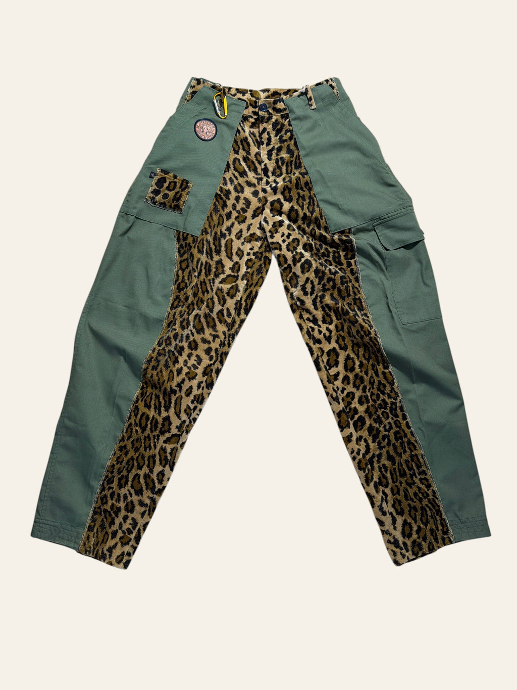 Lolly and Lotus reworked army surplus pants featuring olive green cotton panels and a central leopard print section.