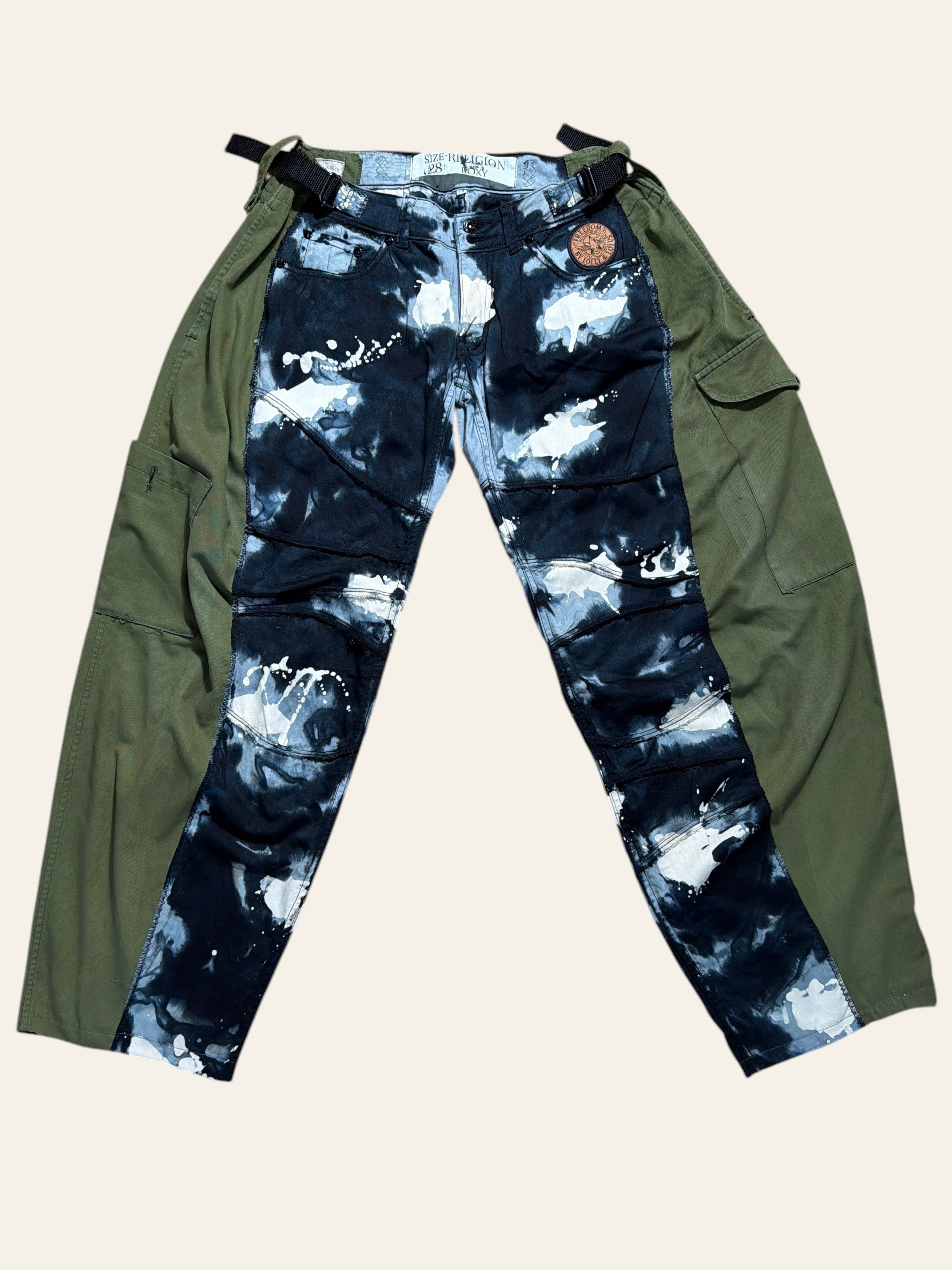 Lolly and Lotus reworked trousers featuring black and white paint splatter denim panels and green army surplus sides.