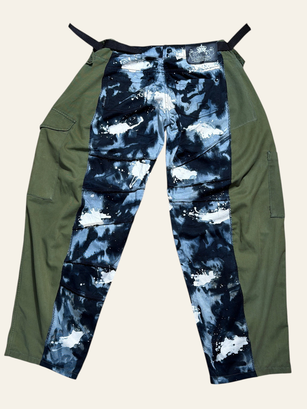 Lolly and Lotus reworked trousers featuring black and white paint splatter denim panels and green army surplus sides.