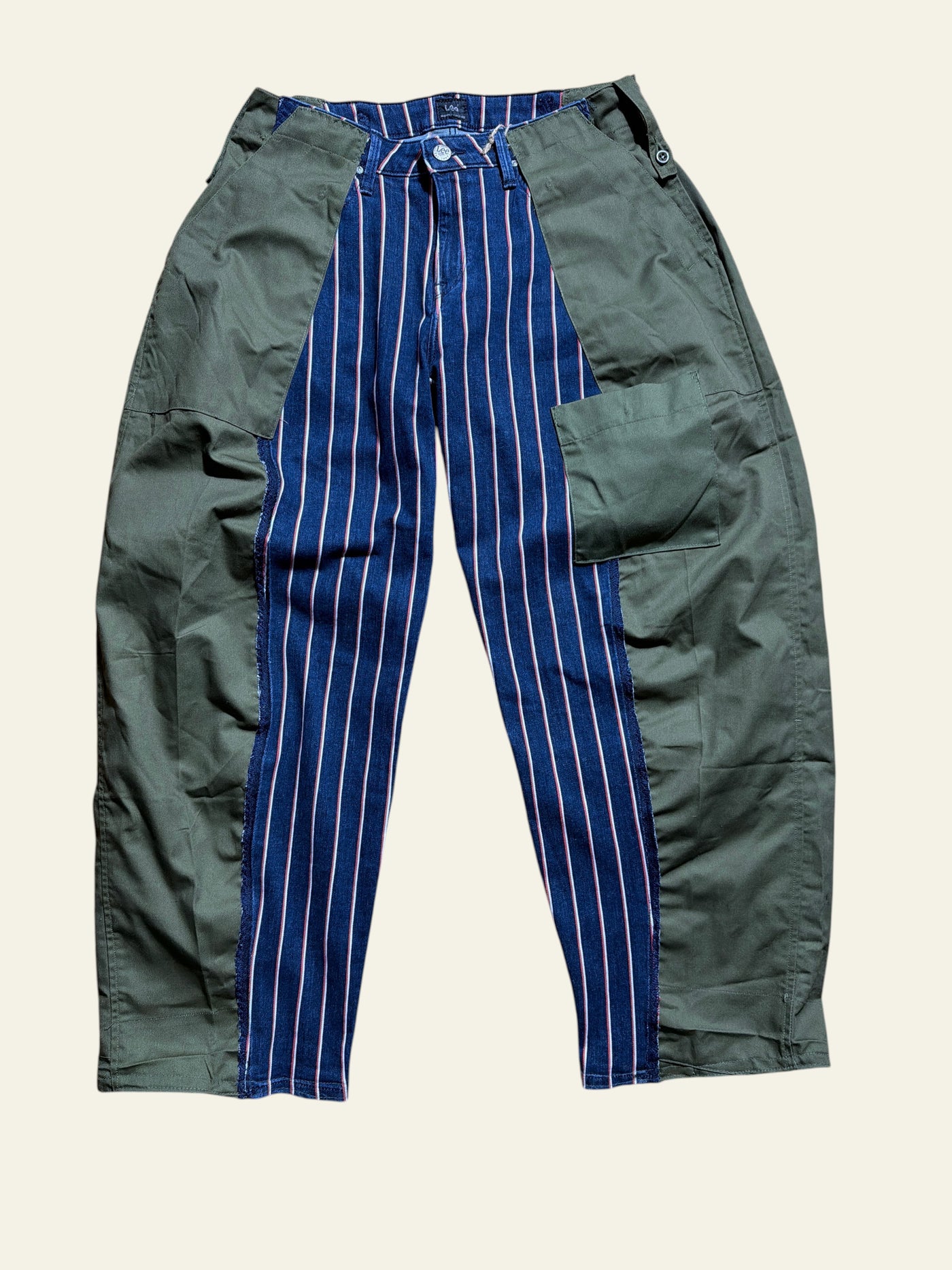 Lolly and Lotus reworked Lee x Army jeans featuring a blue pinstripe denim center panel and olive green side panels.