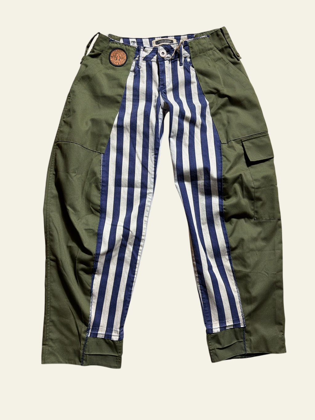 Lolly and Lotus reworked cargo jeans featuring olive green panels and blue and white vertical stripes.