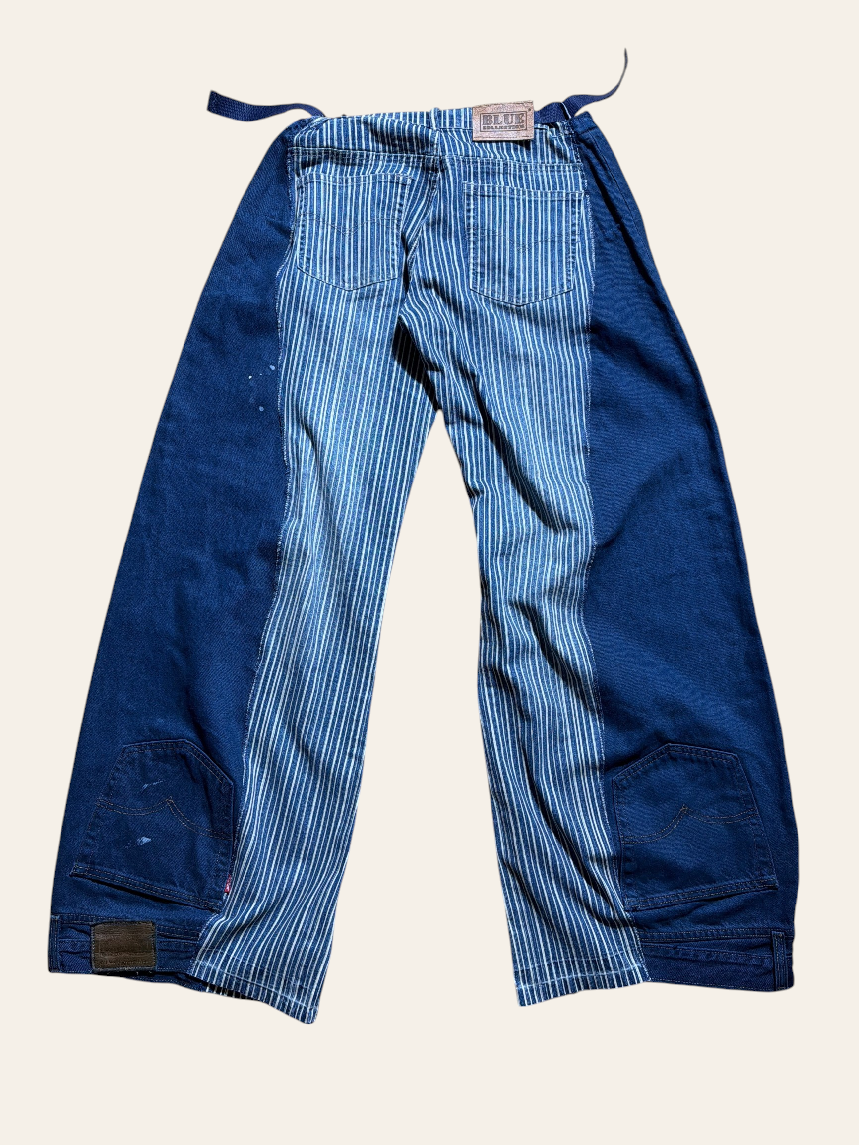 Lolly and Lotus reworked vintage Levi denim jeans featuring an upsidedown design with blue and white striped panels.
