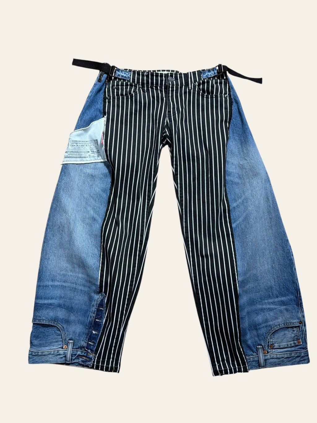 Lolly and Lotus reworked Levi x Ralph Lauren jeans featuring a black and white striped panel with blue denim sides.
