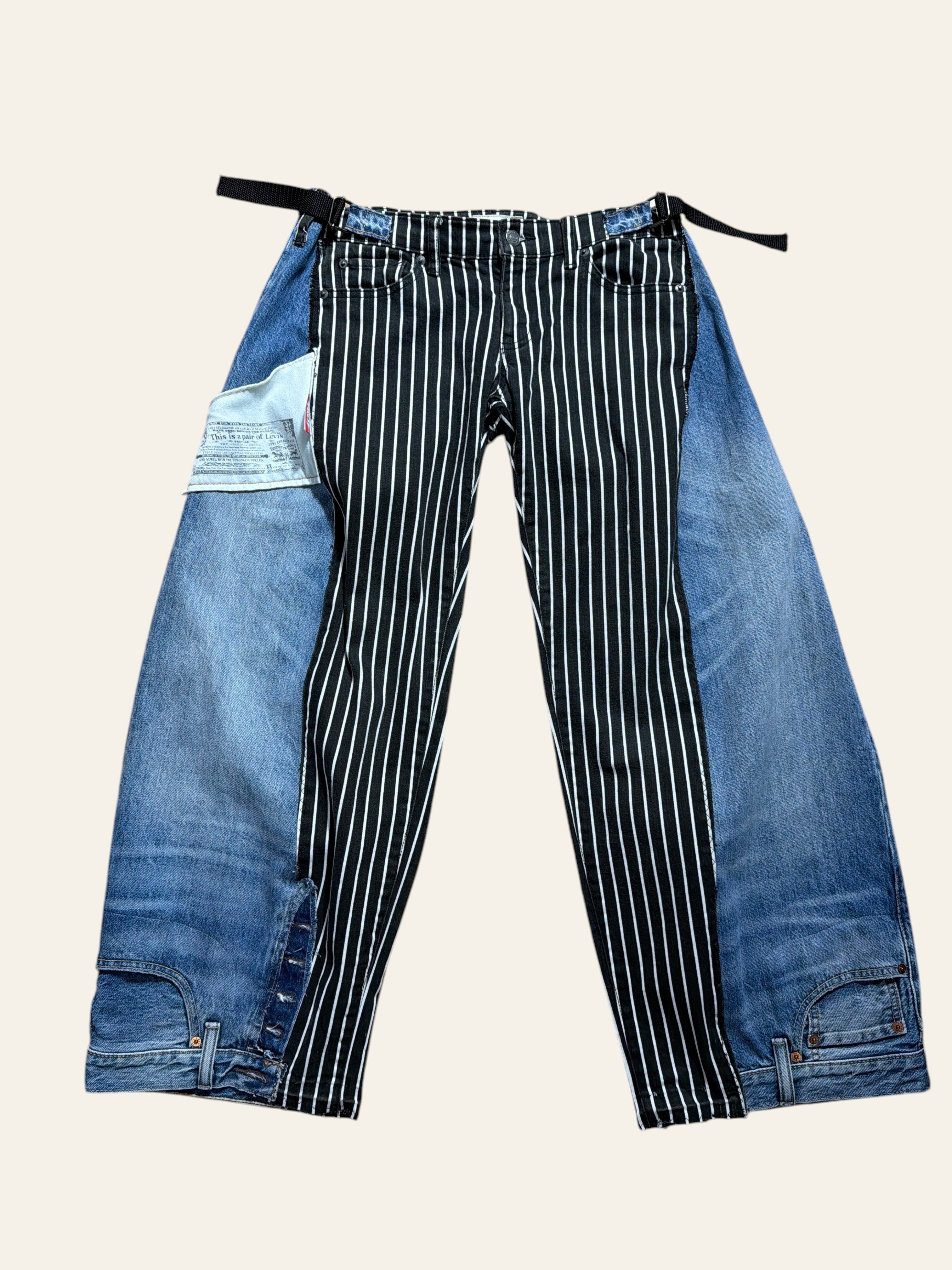 Lolly and Lotus reworked Levi x Ralph Lauren jeans featuring a black and white striped panel with blue denim sides.