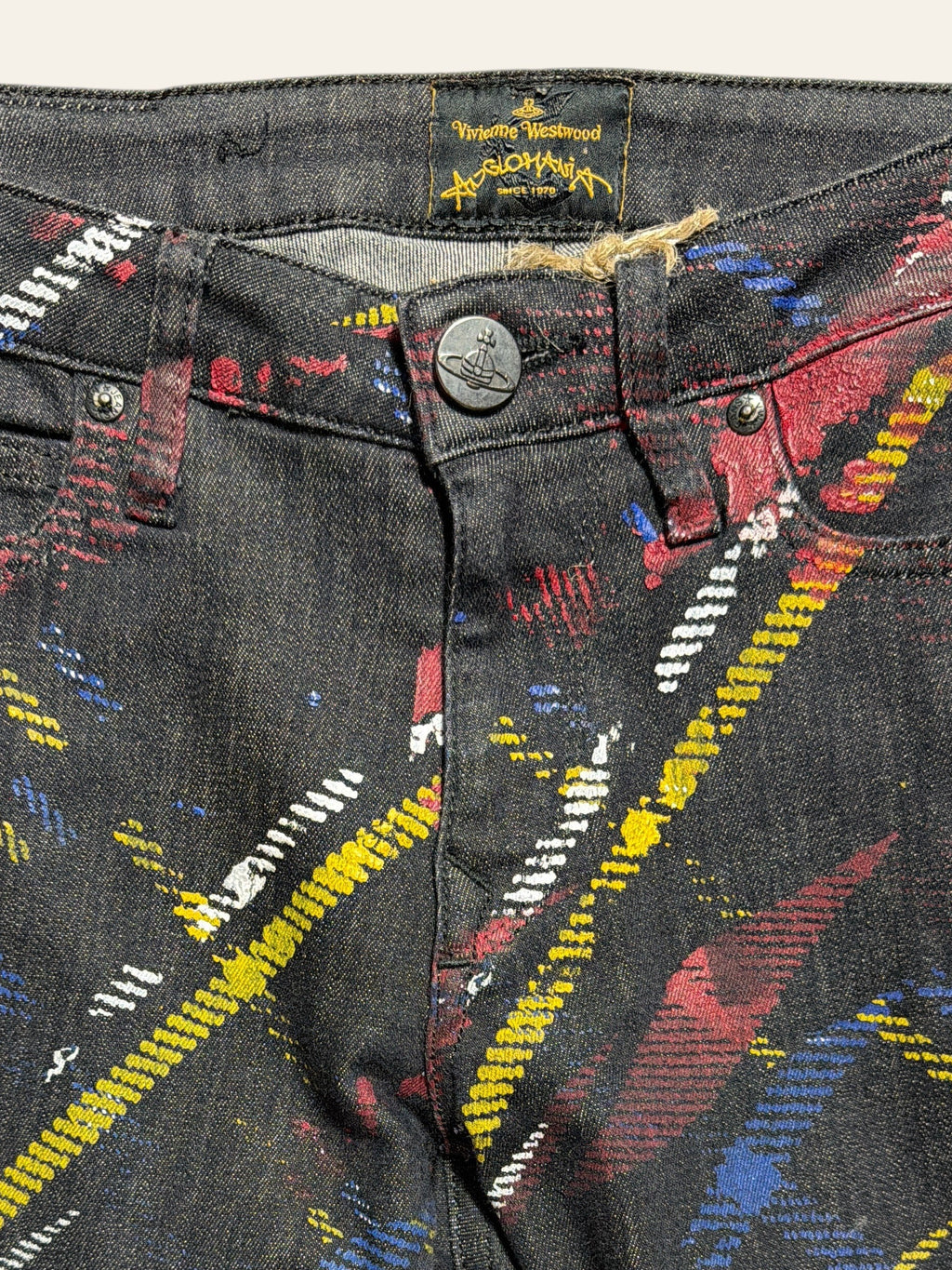 Lolly and Lotus reworked Vivienne Westwood Anglomania black jeans with colorful paint splatter and corduroy panels
