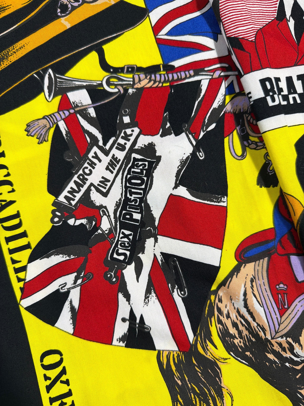 Lolly and Lotus vintage Versace dress shirt featuring a yellow all-over Beatles and Sex Pistols graphic print.