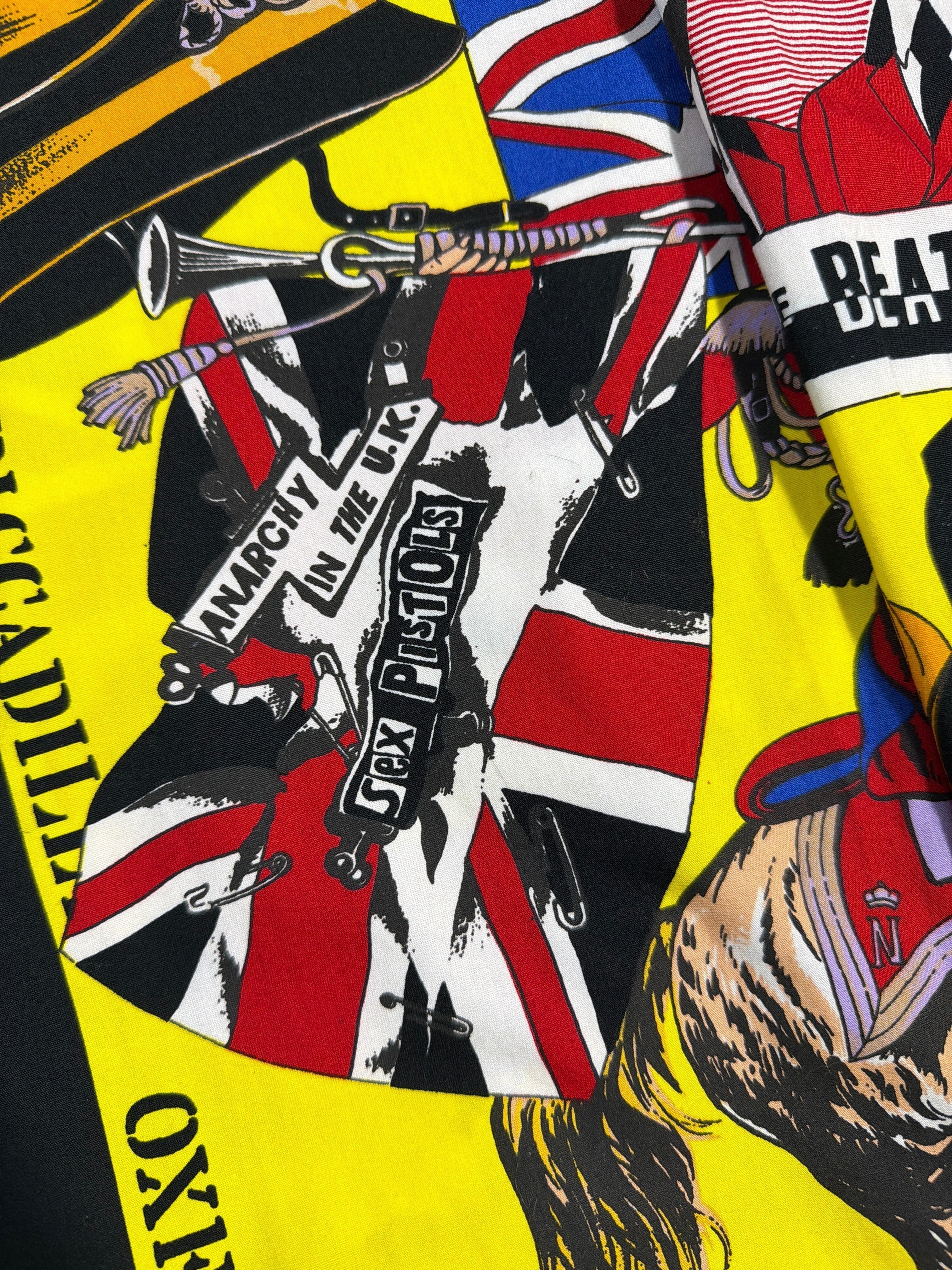 Lolly and Lotus vintage Versace dress shirt featuring a yellow all-over Beatles and Sex Pistols graphic print.