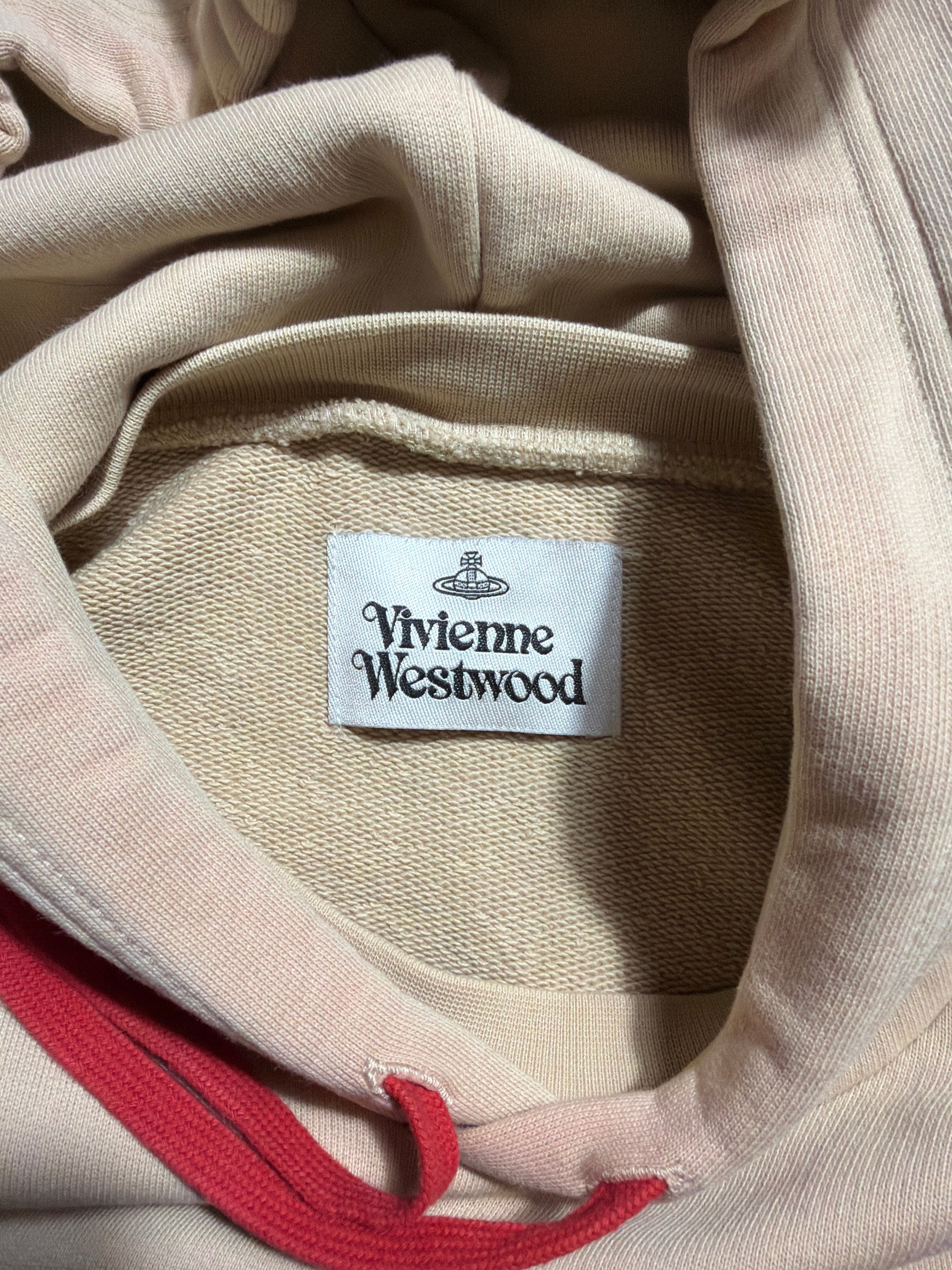 Lolly and Lotus Vivienne Westwood Pourpoint hoodie in beige with a red drawstring and interior brand label