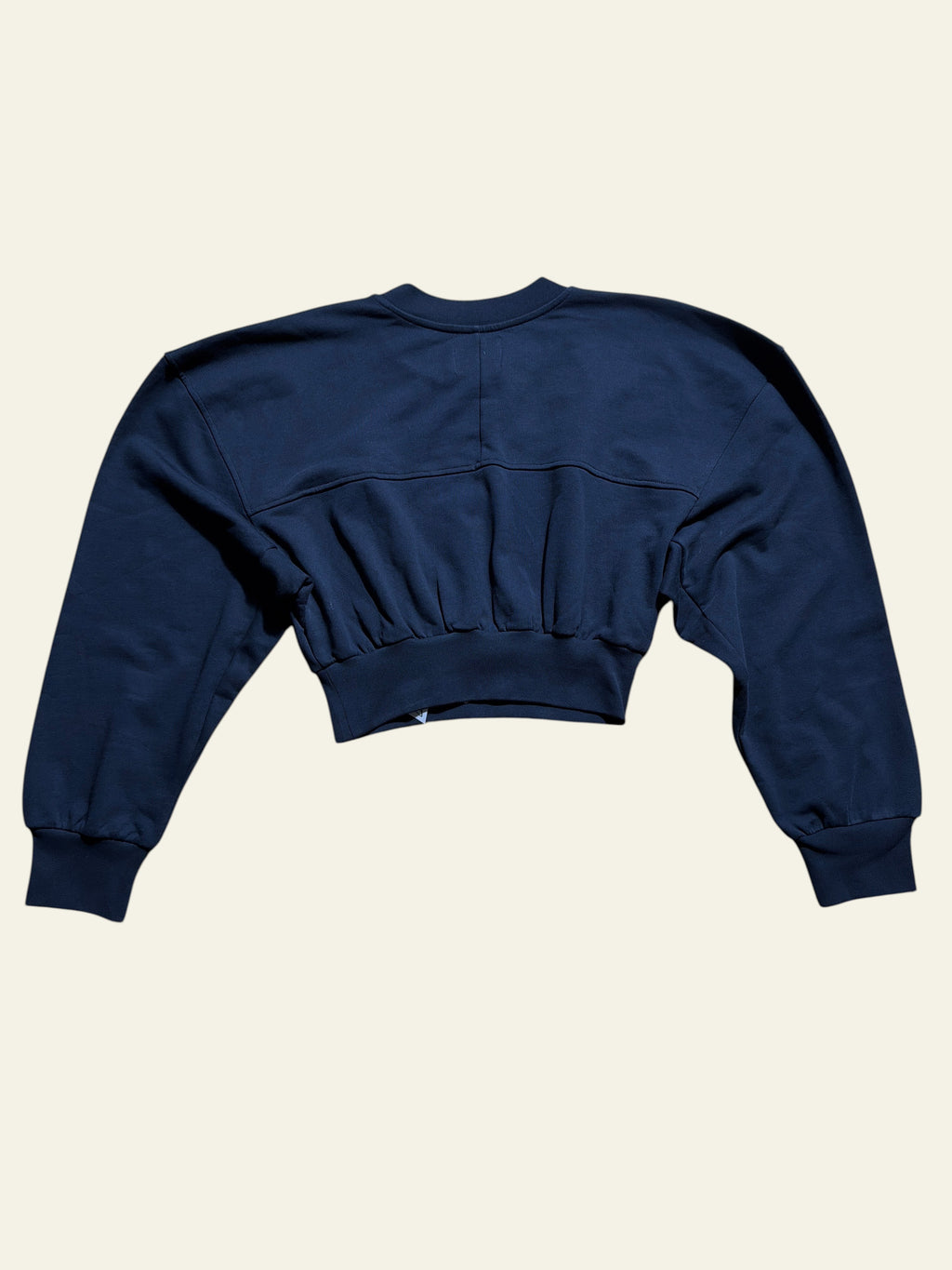 Lolly and Lotus Vivienne Westwood black cropped sweatshirt with gathered waist and long sleeves on wooden floor