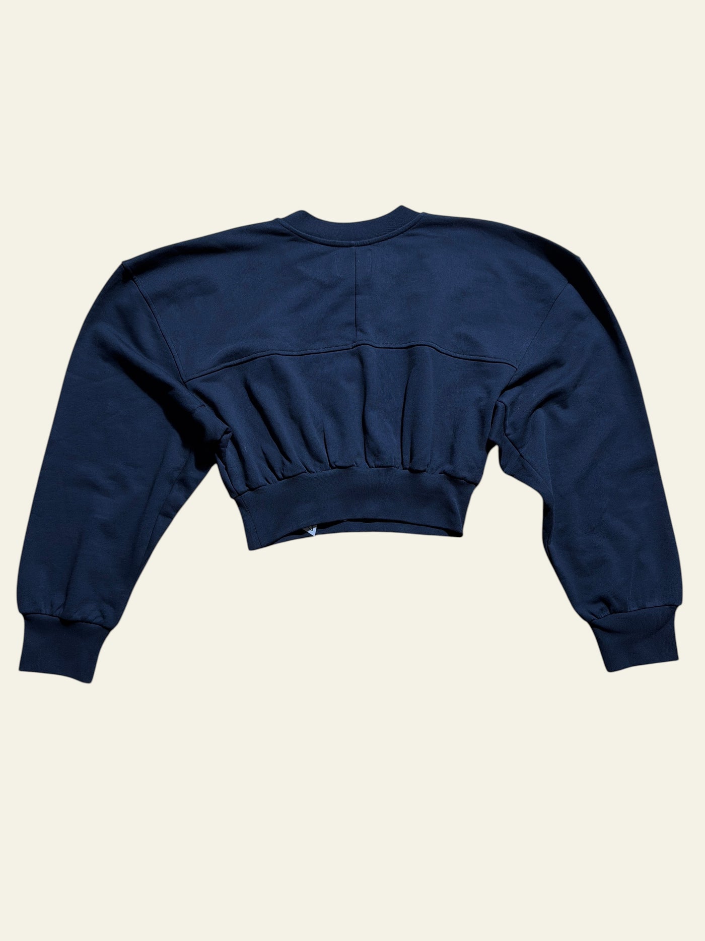Lolly and Lotus Vivienne Westwood black cropped sweatshirt with gathered waist and long sleeves on wooden floor
