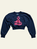 Lolly and Lotus Vivienne Westwood black cropped sweatshirt with red Sunken Orb graphic logo on a wooden floor