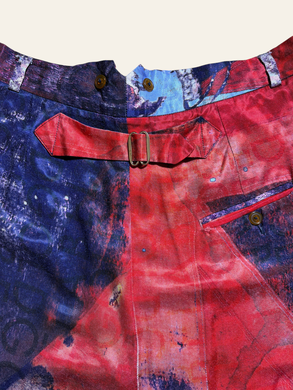 Lolly and Lotus Vivienne Westwood trousers featuring an abstract Union Jack print with a buckle-back detail.