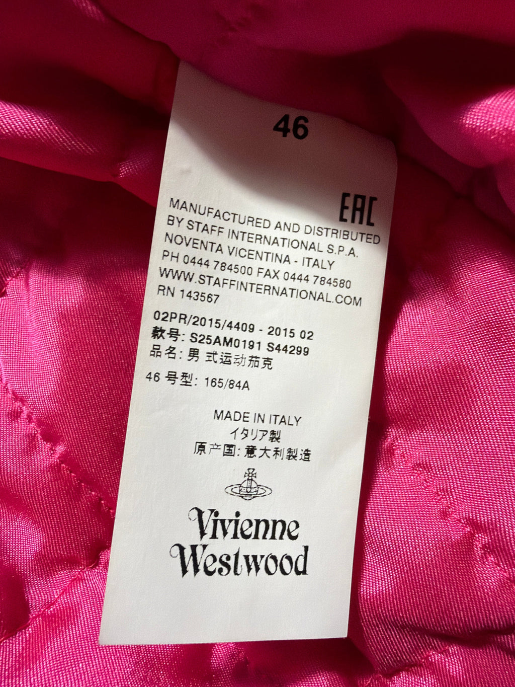 Lolly and Lotus Vivienne Westwood MAN bomber jacket interior care label with size 46 on a hot pink quilted lining