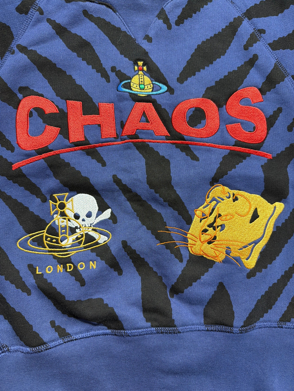Lolly and Lotus Vivienne Westwood Chaos cropped jumper in blue and black tiger stripe with embroidered graphic details