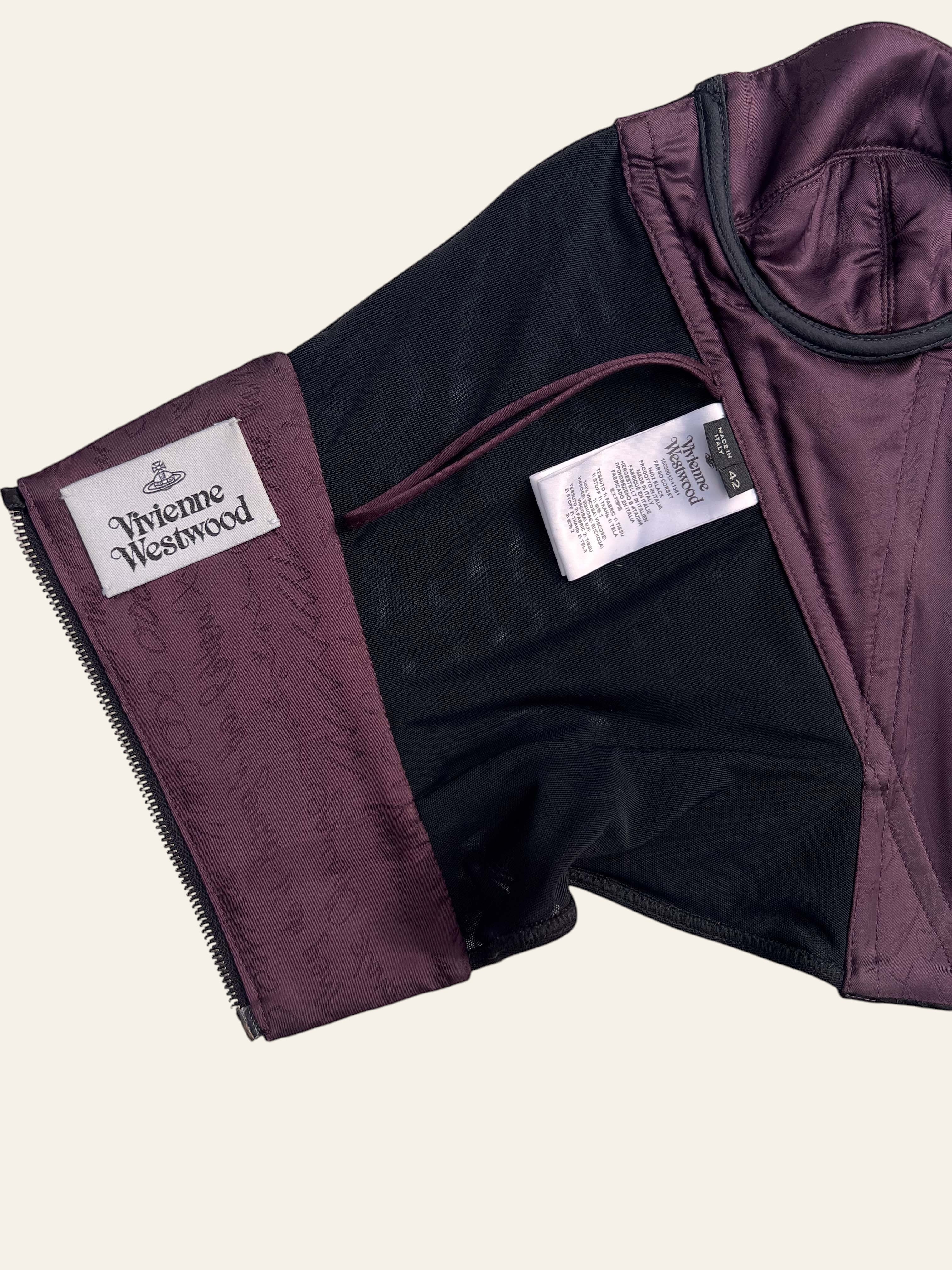 Lolly and Lotus Vivienne Westwood corset interior showing purple lining, brand label, and care tag details.