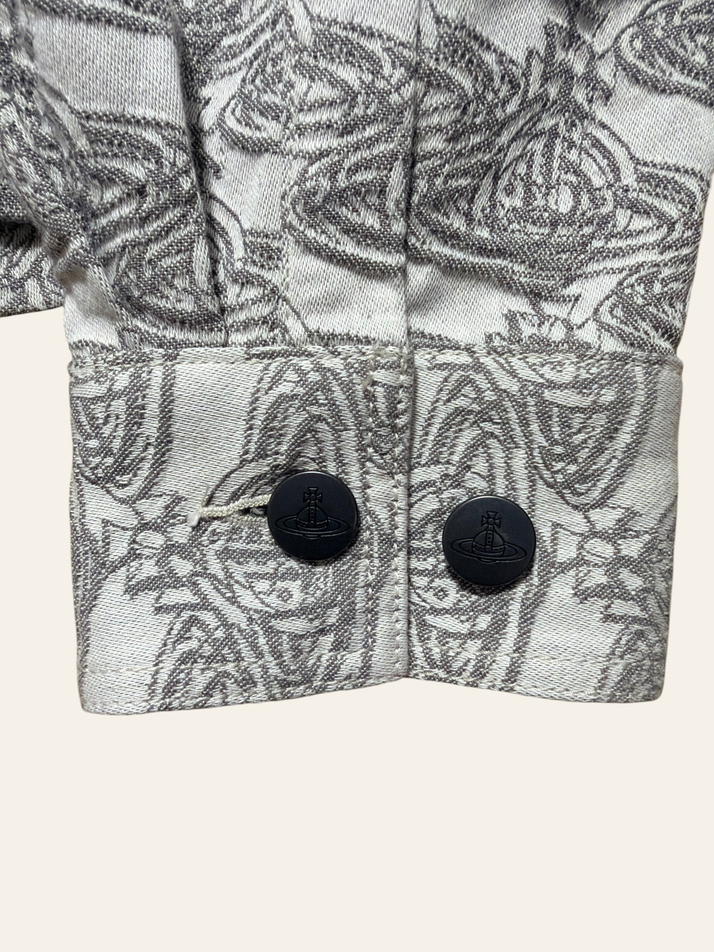 Lolly and Lotus Vivienne Westwood denim jacket cuff with grey Orb pattern and branded black buttons