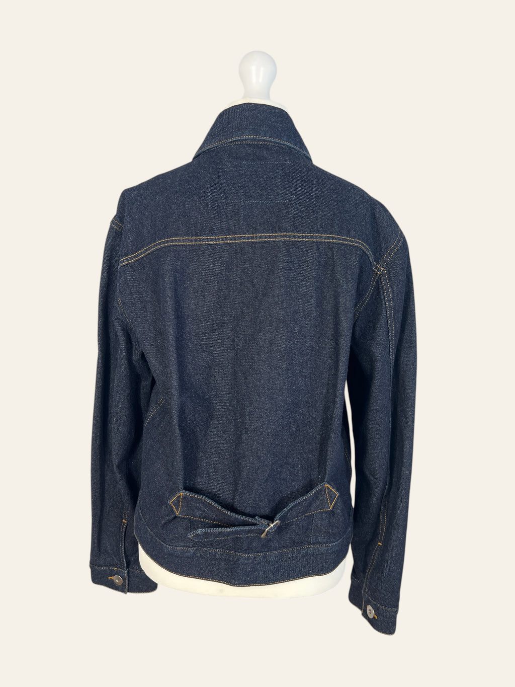 Back view of a Lolly and Lotus VIVIENNE WESTWOOD ANGLOMANIA dark wash denim jacket with a cinch back detail.
