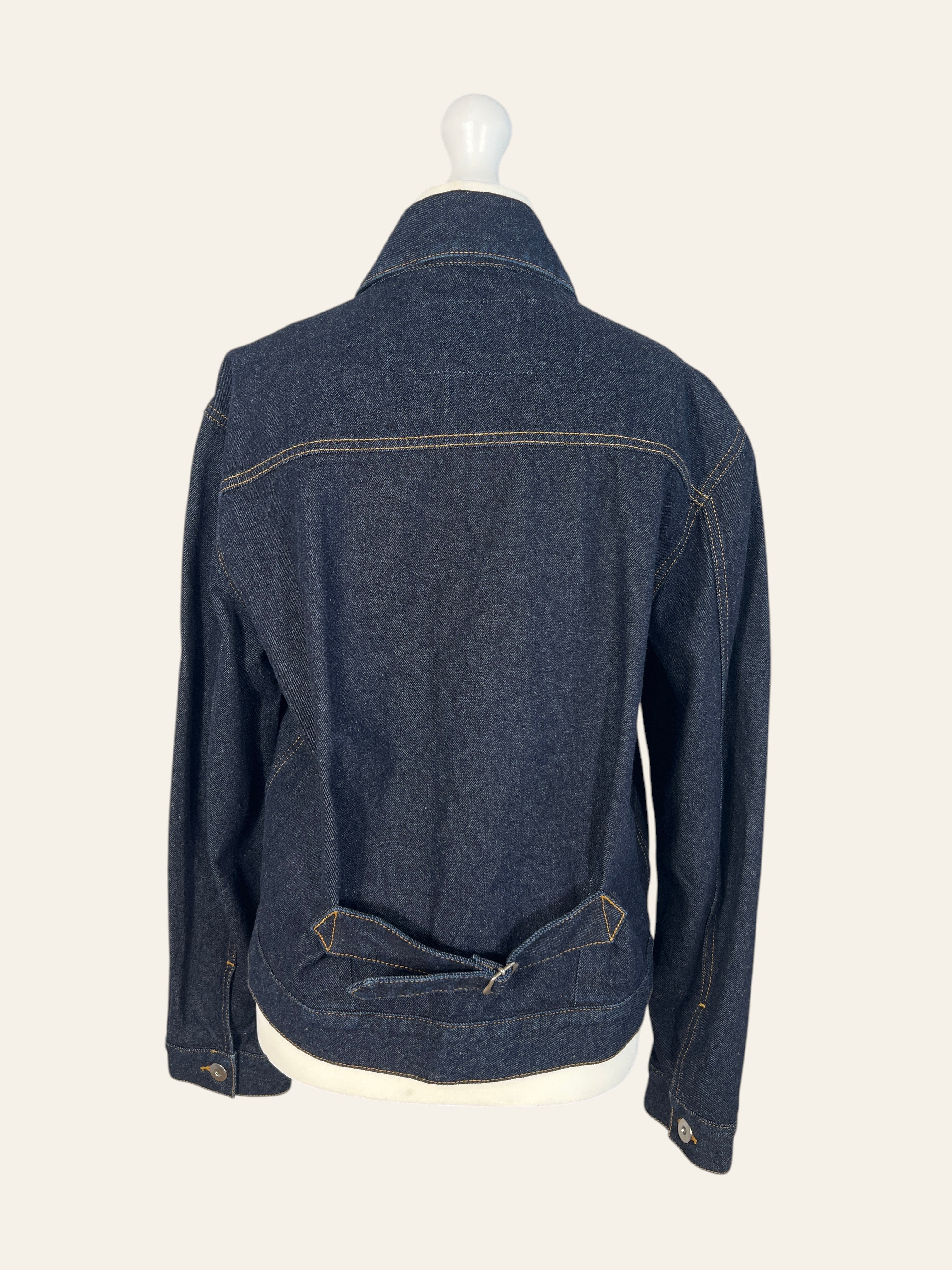 Back view of a Lolly and Lotus VIVIENNE WESTWOOD ANGLOMANIA dark wash denim jacket with a cinch back detail.