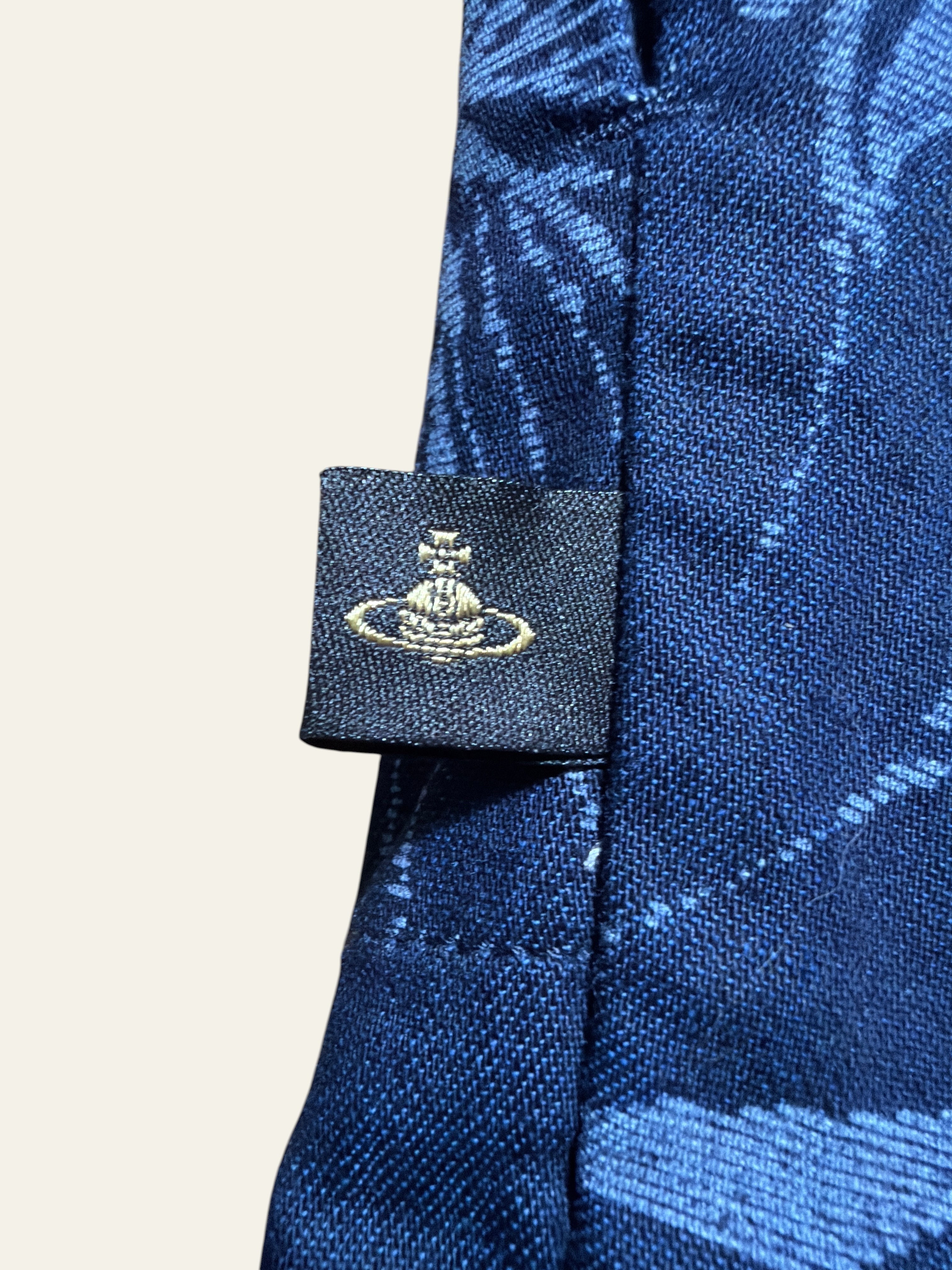 Lolly and Lotus Vivienne Westwood Anglomania denim shirt featuring the iconic gold orb logo tag on blue fabric