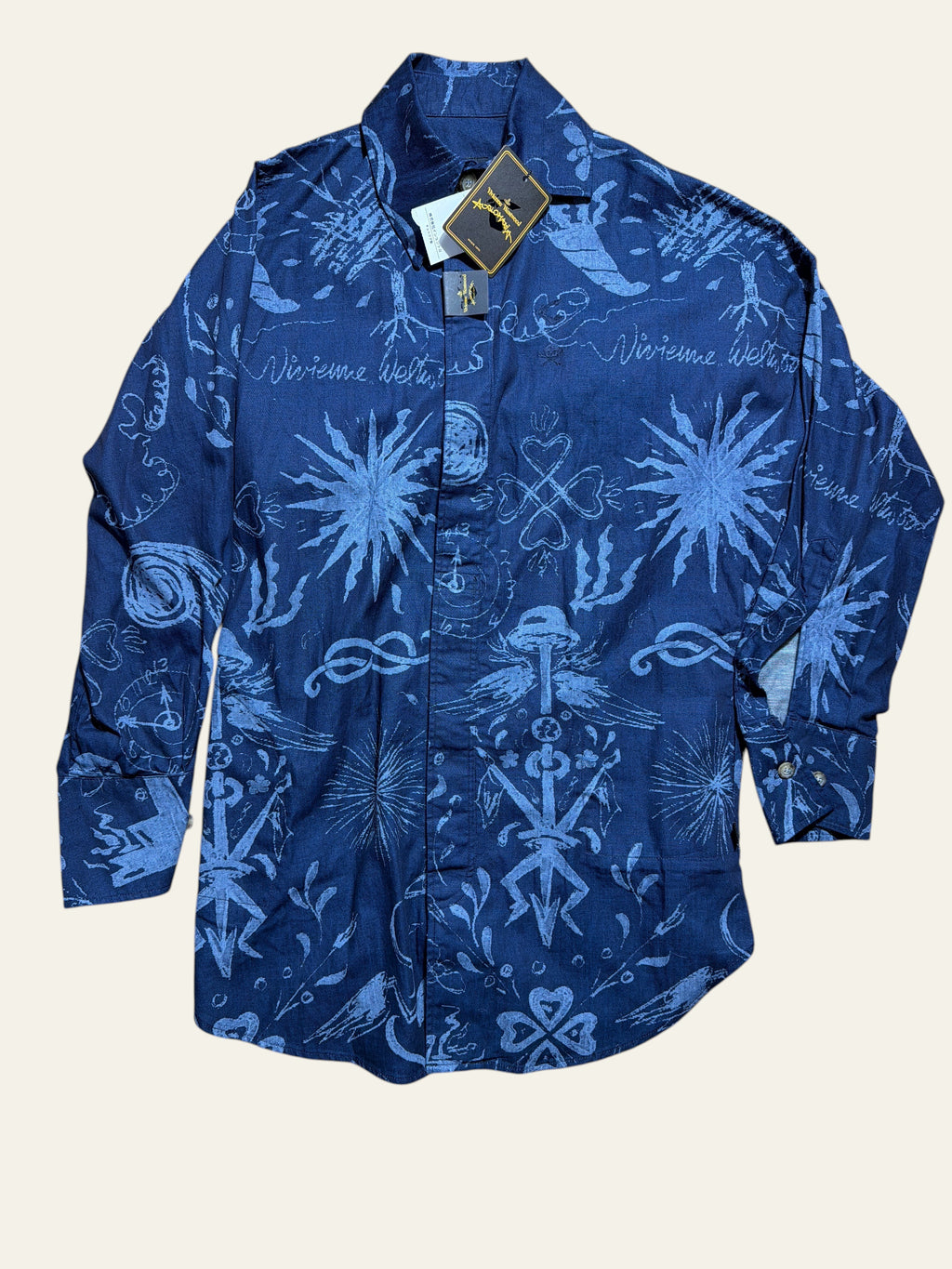 Lolly and Lotus Vivienne Westwood Anglomania dark blue denim long shirt with white celestial and floral print patterns.