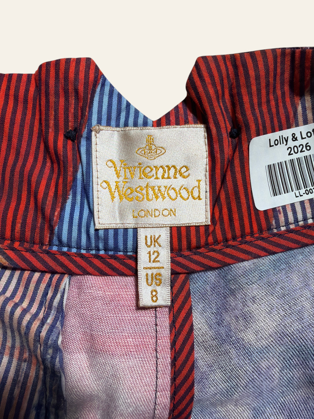 Lolly and Lotus Vivienne Westwood trousers label showing UK 12 and US 8 sizing on striped fabric