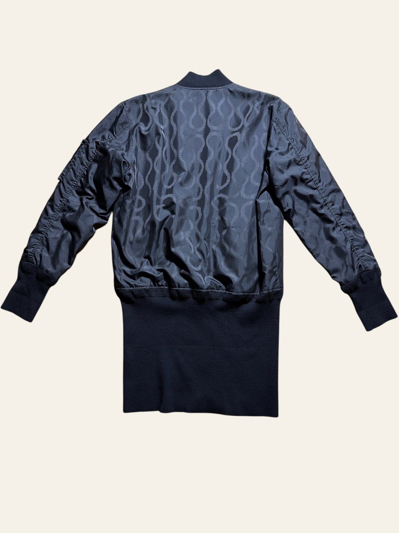 Lolly and Lotus Vivienne Westwood MAN black jacquard longline bomber jacket with extended ribbed hem, back view.