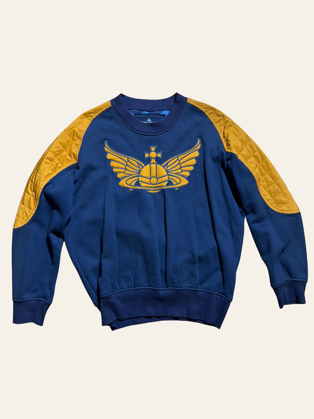 Lolly and Lotus Vivienne Westwood Anglomania navy cotton sweatshirt with gold quilted shoulders and Winged Orb logo.