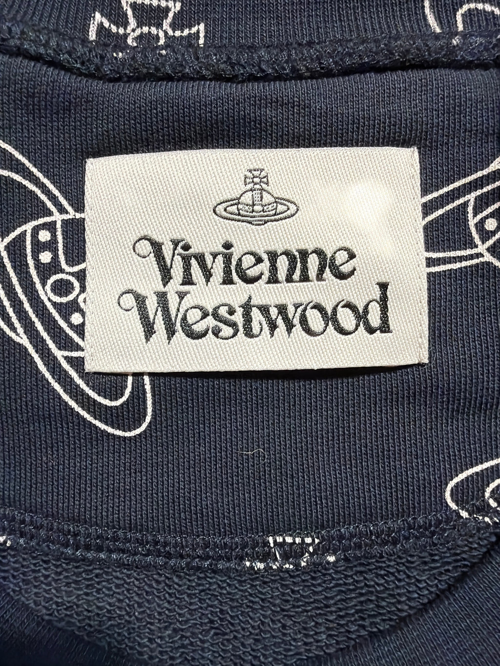Lolly and Lotus Vivienne Westwood navy blue raglan sweatshirt featuring a white orb logo print and brand label