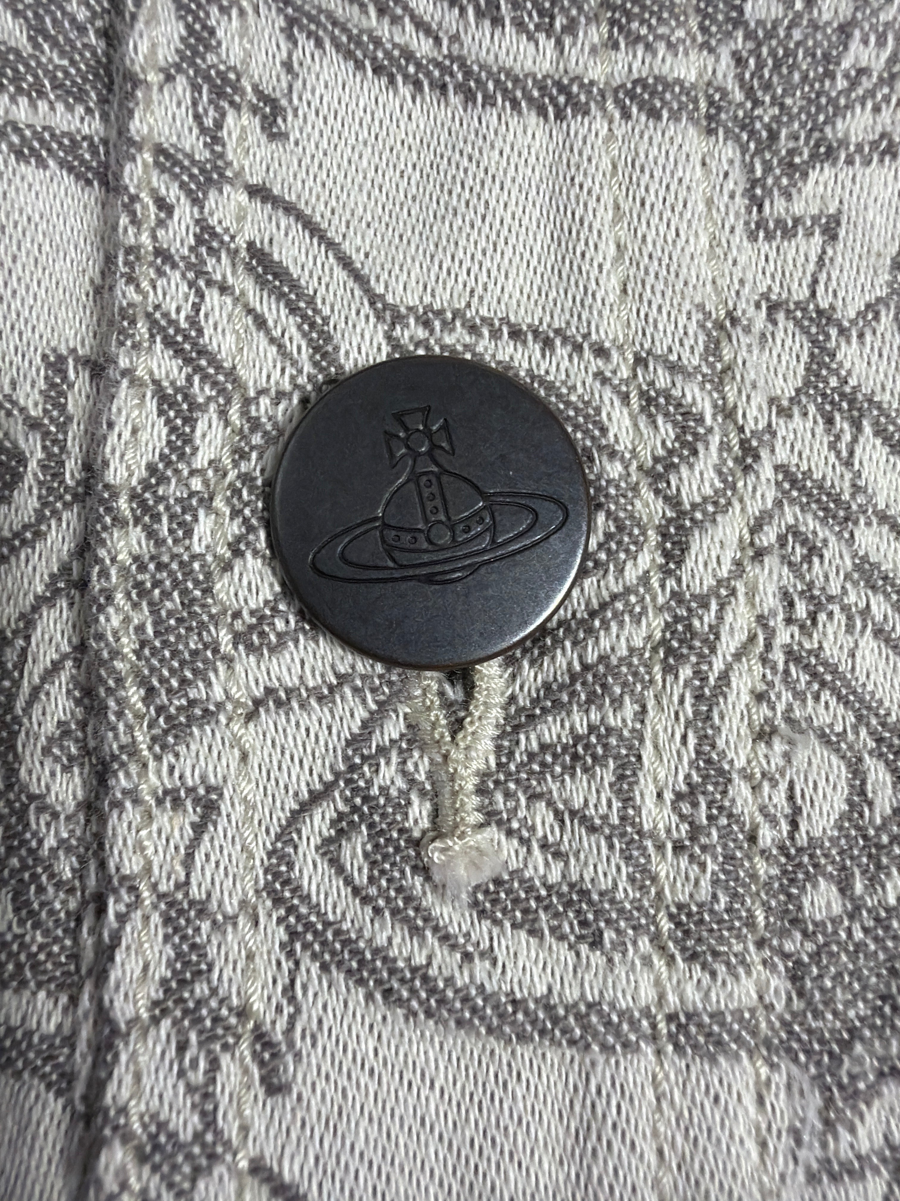 Lolly and Lotus Vivienne Westwood denim jacket featuring a dark metal button embossed with the iconic Orb logo