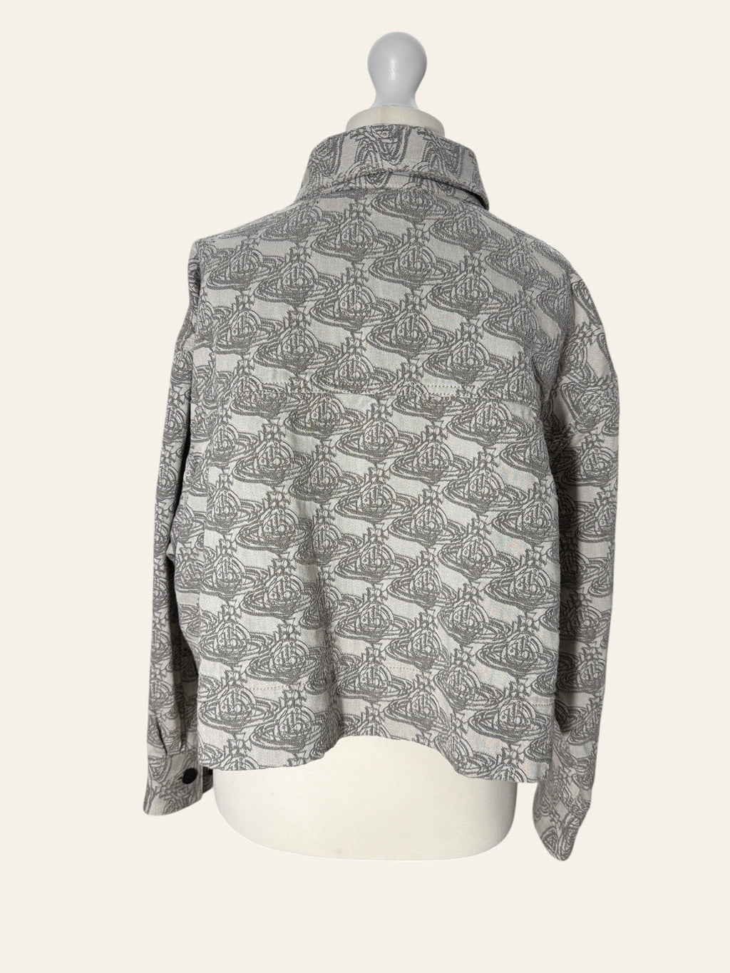 Lolly and Lotus Vivienne Westwood grey and white denim jacket with all-over Orb logo print on a mannequin
