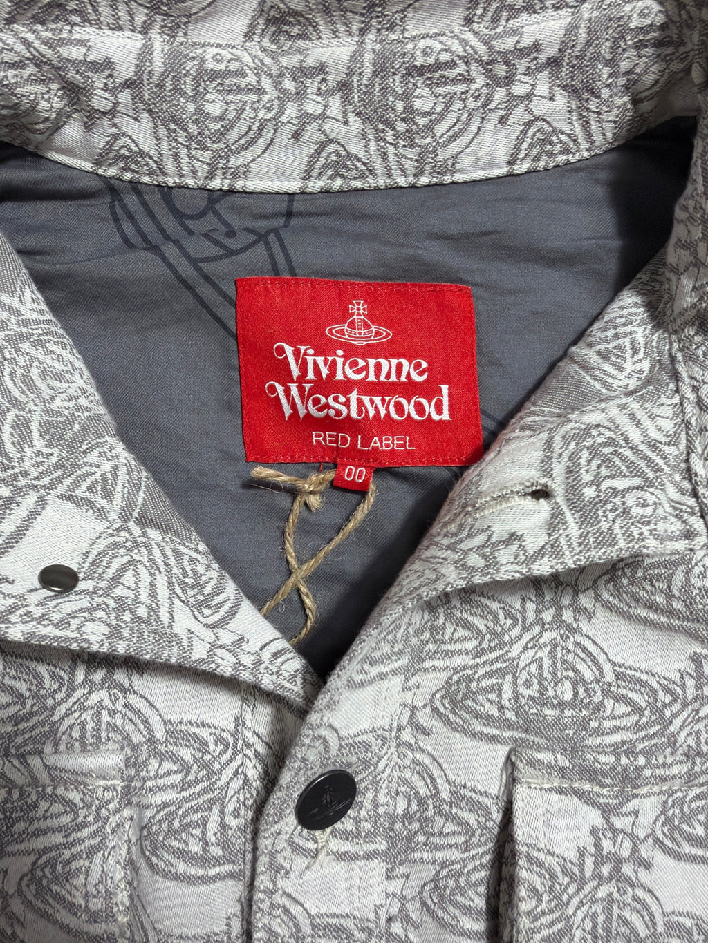 Lolly and Lotus Vivienne Westwood Red Label denim jacket featuring a grey and white orb pattern and size 00 tag.
