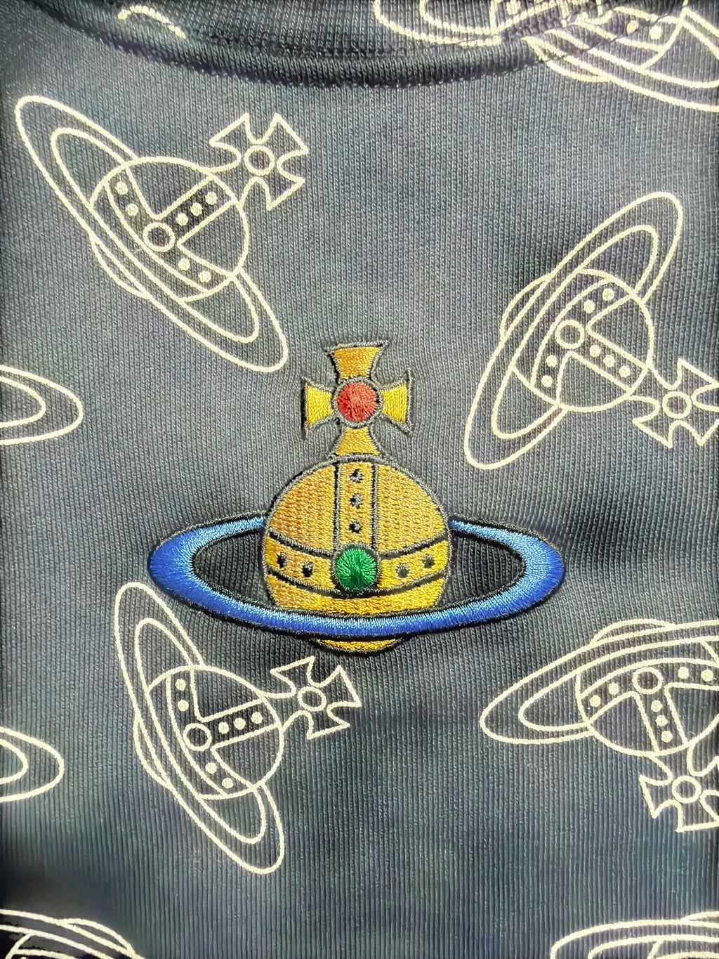 Lolly and Lotus Vivienne Westwood unisex sweatshirt featuring an embroidered orb logo on a grey patterned fabric