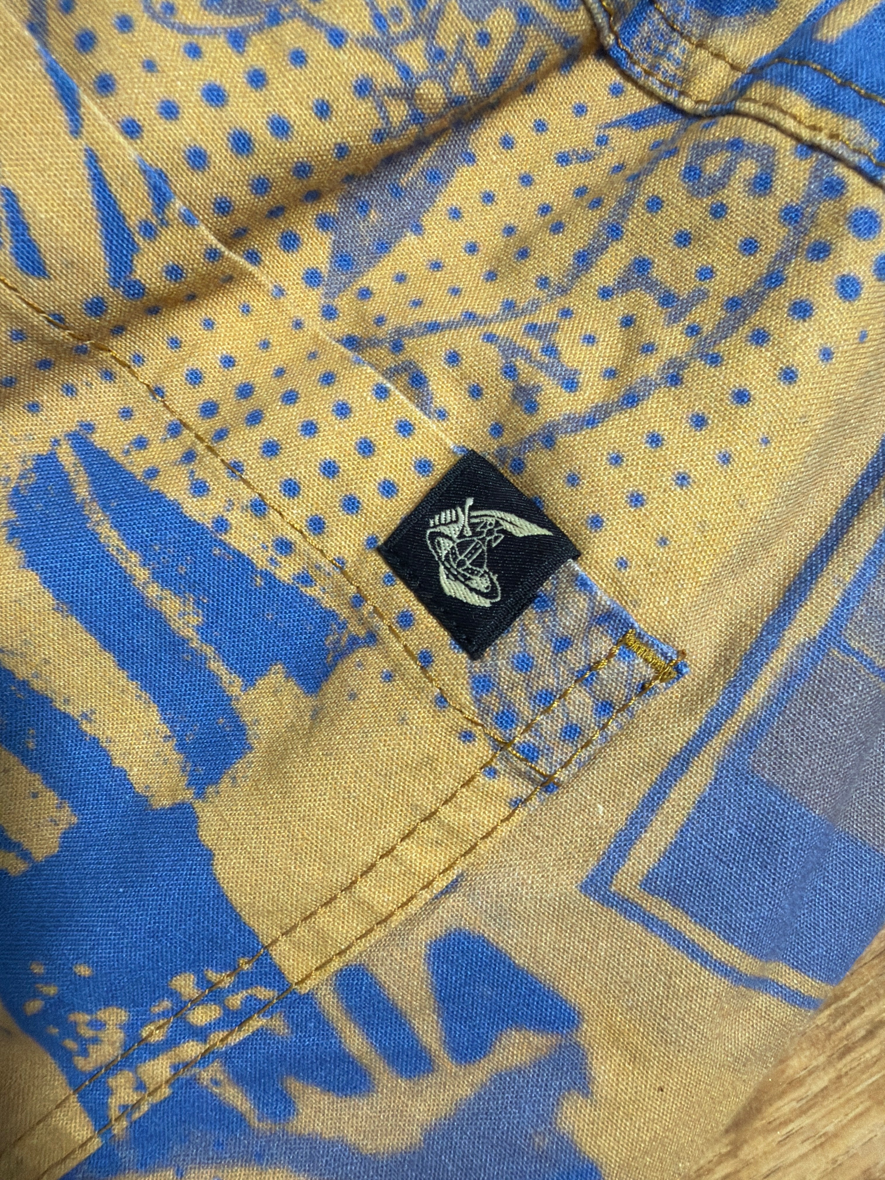 Lolly and Lotus Vivienne Westwood Anglomania shirt featuring a blue and yellow graphic print with a signature orb tab