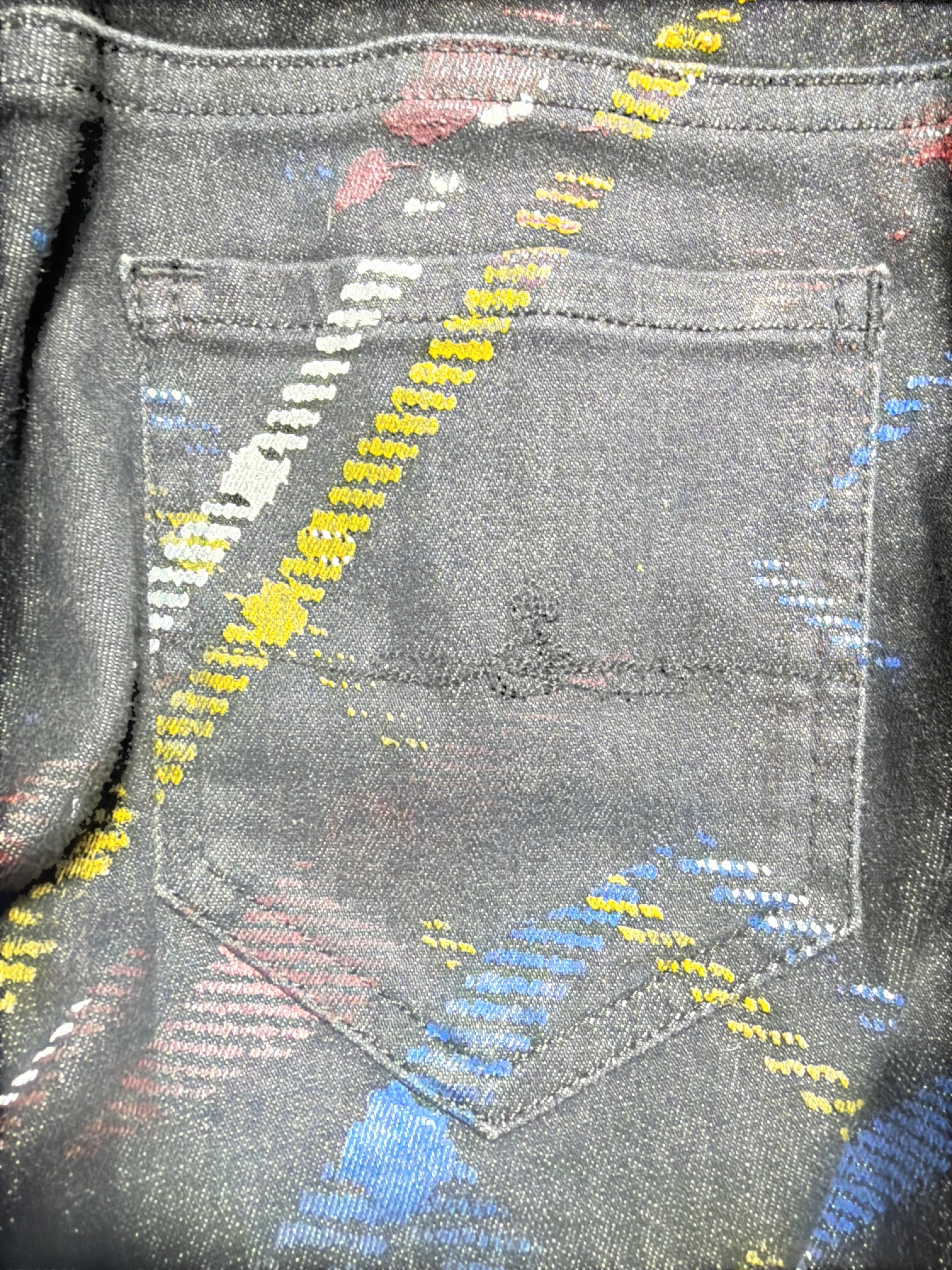Lolly and Lotus reworked Vivienne Westwood Anglomania black denim jeans with colorful paint splatter pocket detail