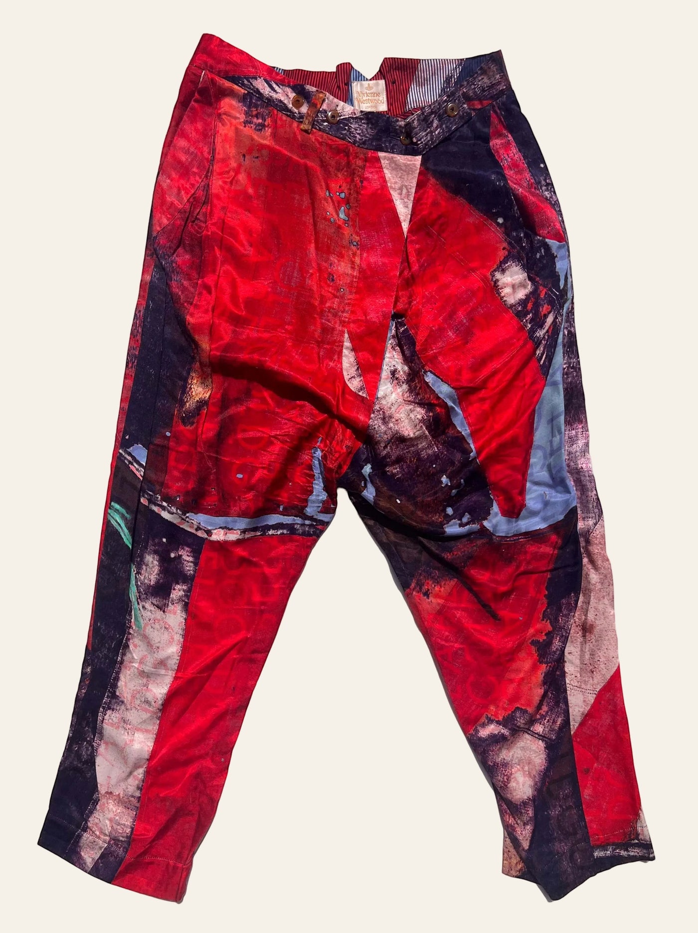 Lolly and Lotus Vivienne Westwood cropped trousers with an abstract red, purple, and blue Union Jack print.