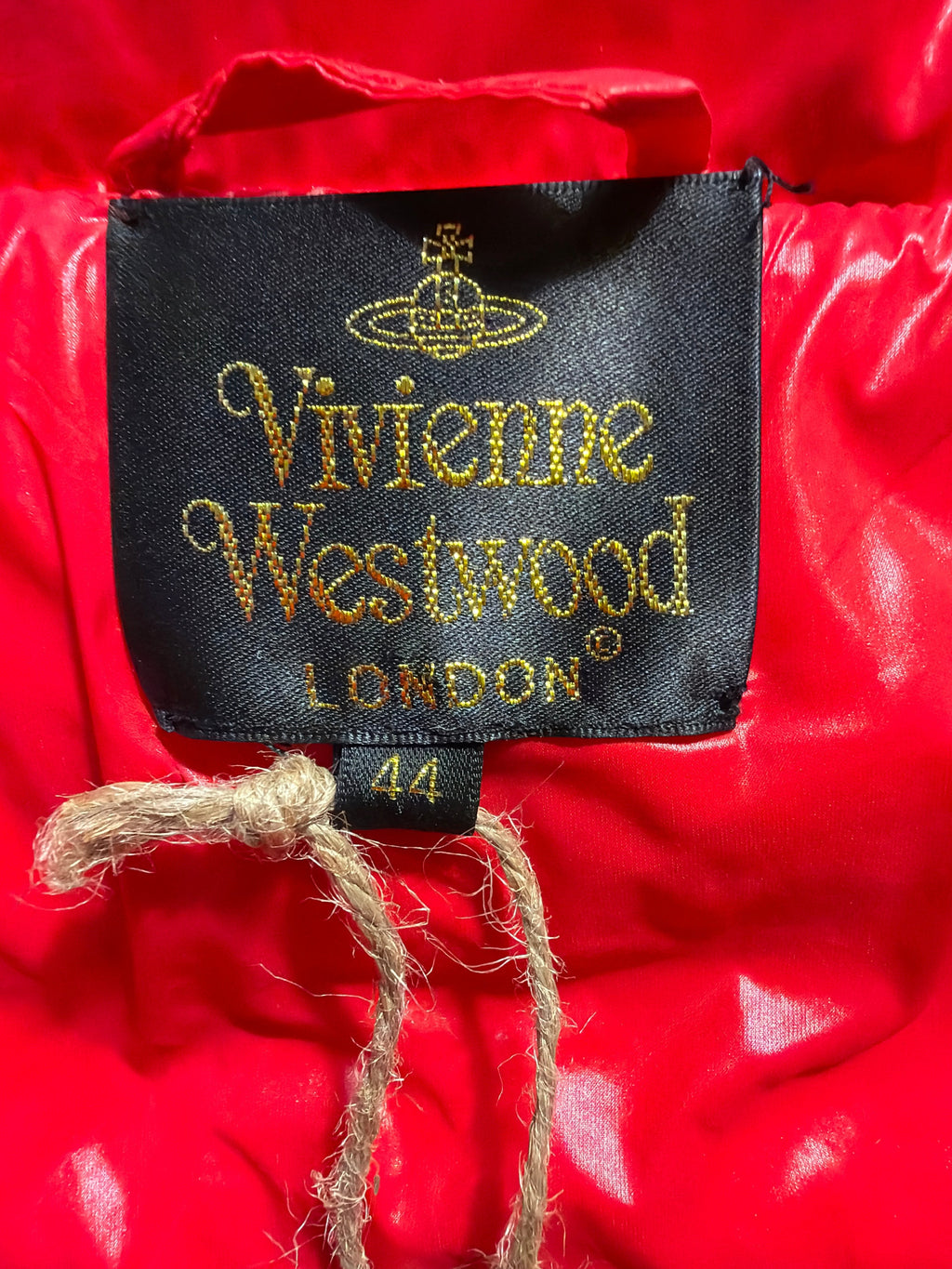 Vivienne Westwood puffer jacket label in red with gold embroidery, sold by Lolly and Lotus, size 44 tag