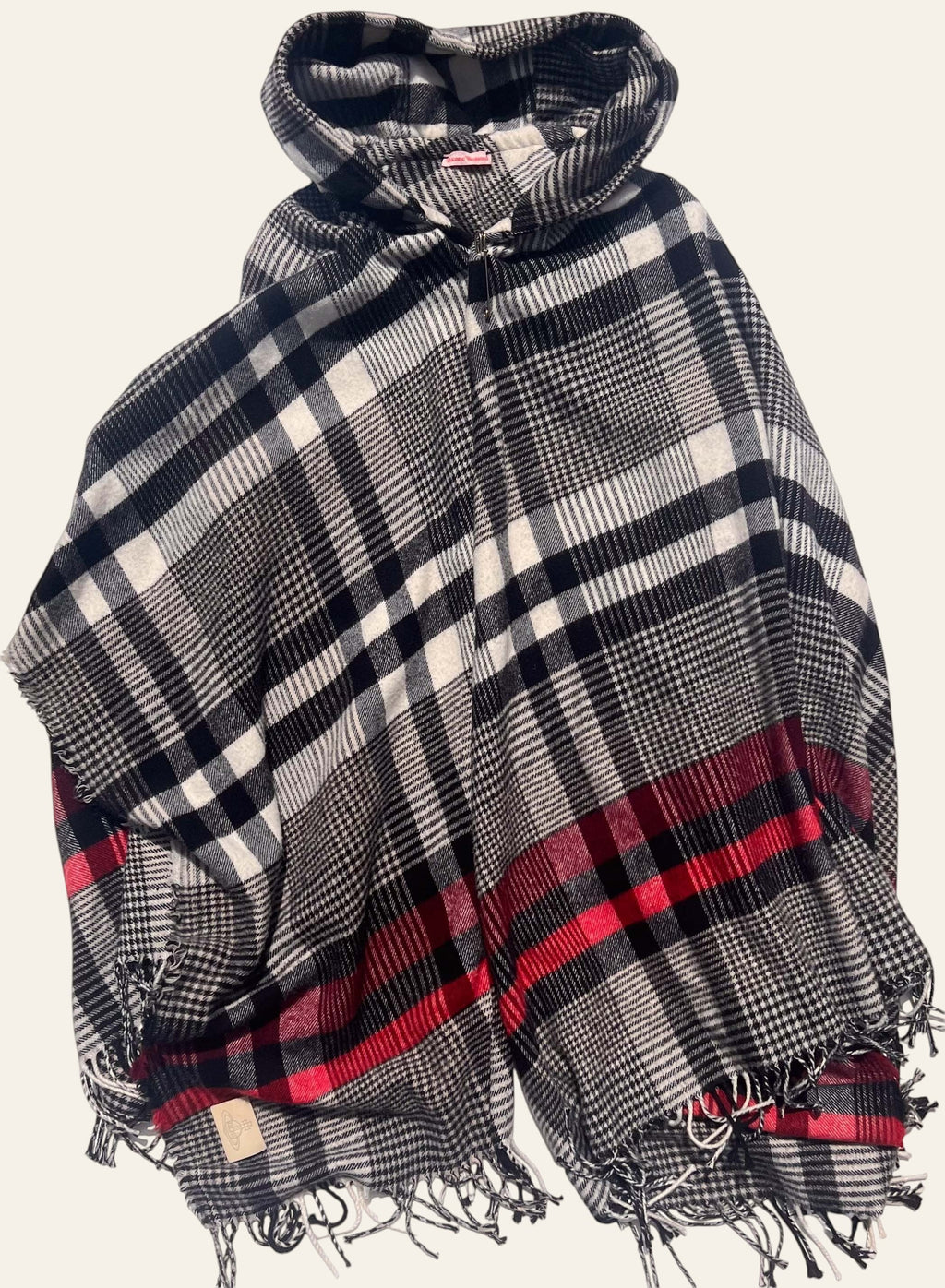 Lolly and Lotus Vivienne Westwood hooded poncho in black, cream, and red tartan with fringed edges and Orb logo patch.