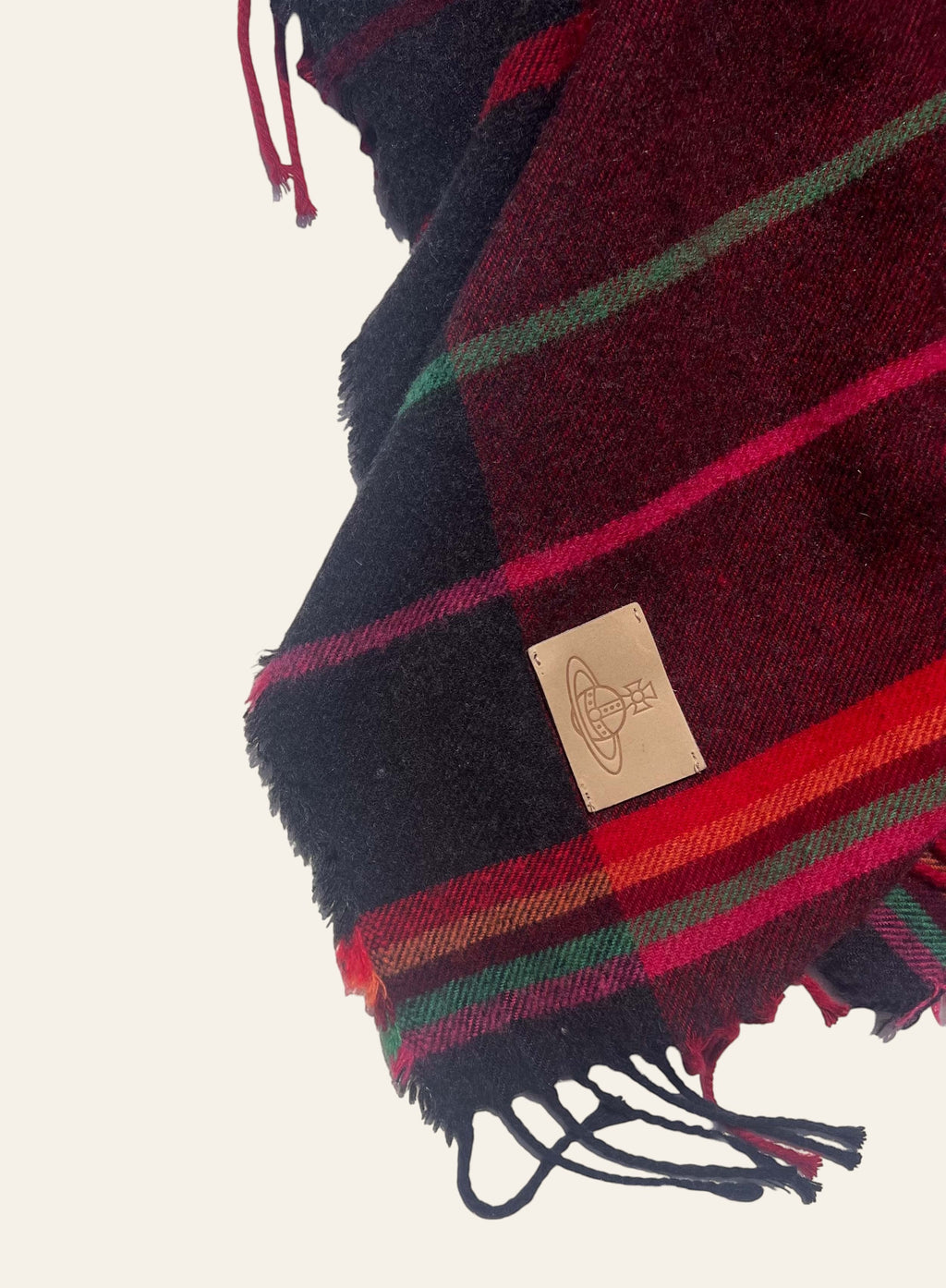 Lolly and Lotus Vivienne Westwood hooded tartan poncho in burgundy, black, and red with fringed hem and Orb patch.
