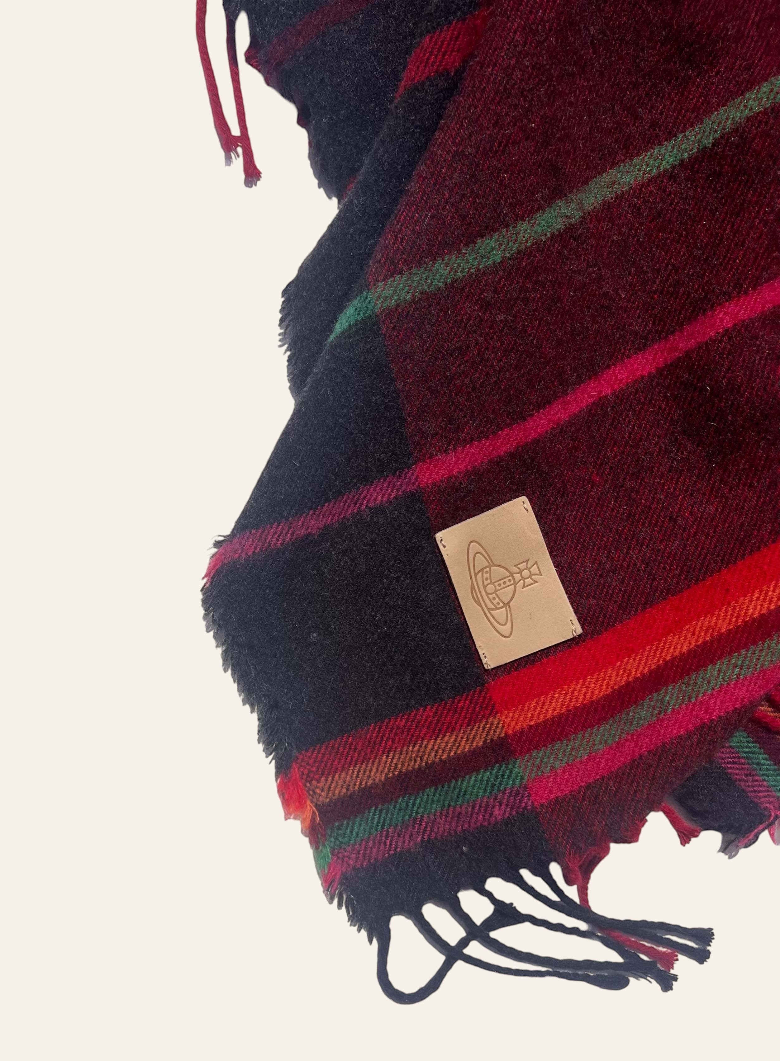 Lolly and Lotus Vivienne Westwood hooded tartan poncho in burgundy, black, and red with fringed hem and Orb patch.