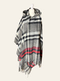 Lolly and Lotus Vivienne Westwood hooded poncho in black, cream, and red tartan with fringed edges on a mannequin.