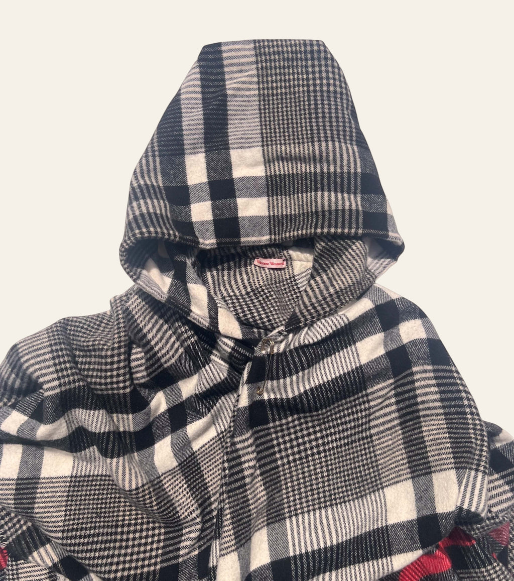 Lolly and Lotus Vivienne Westwood hooded poncho in black and cream tartan check with a front clasp closure