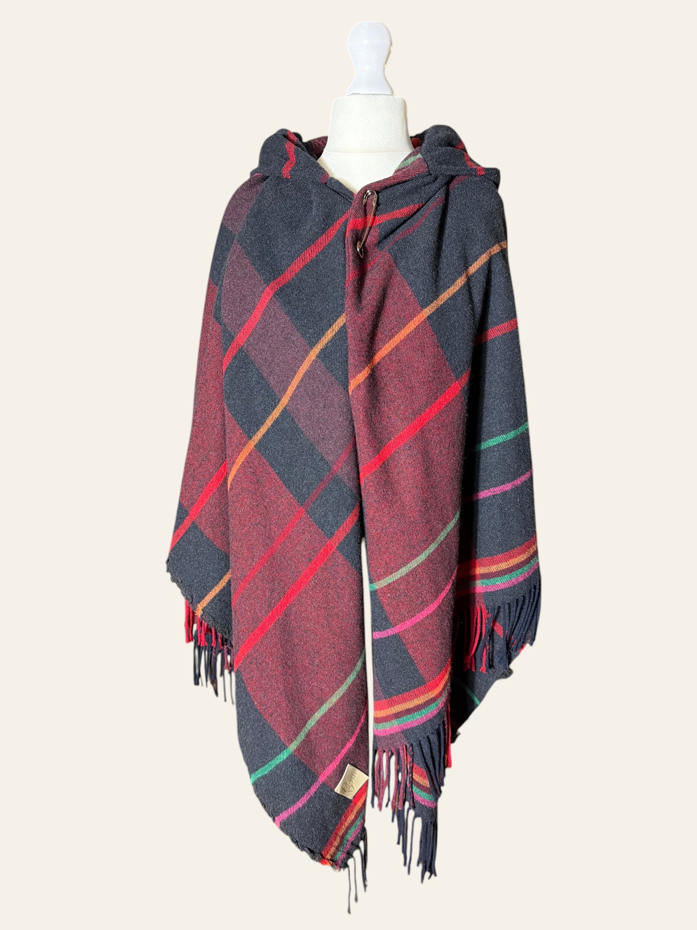 Lolly and Lotus Vivienne Westwood hooded tartan poncho in burgundy, black, and red with fringe hem and Orb patch.